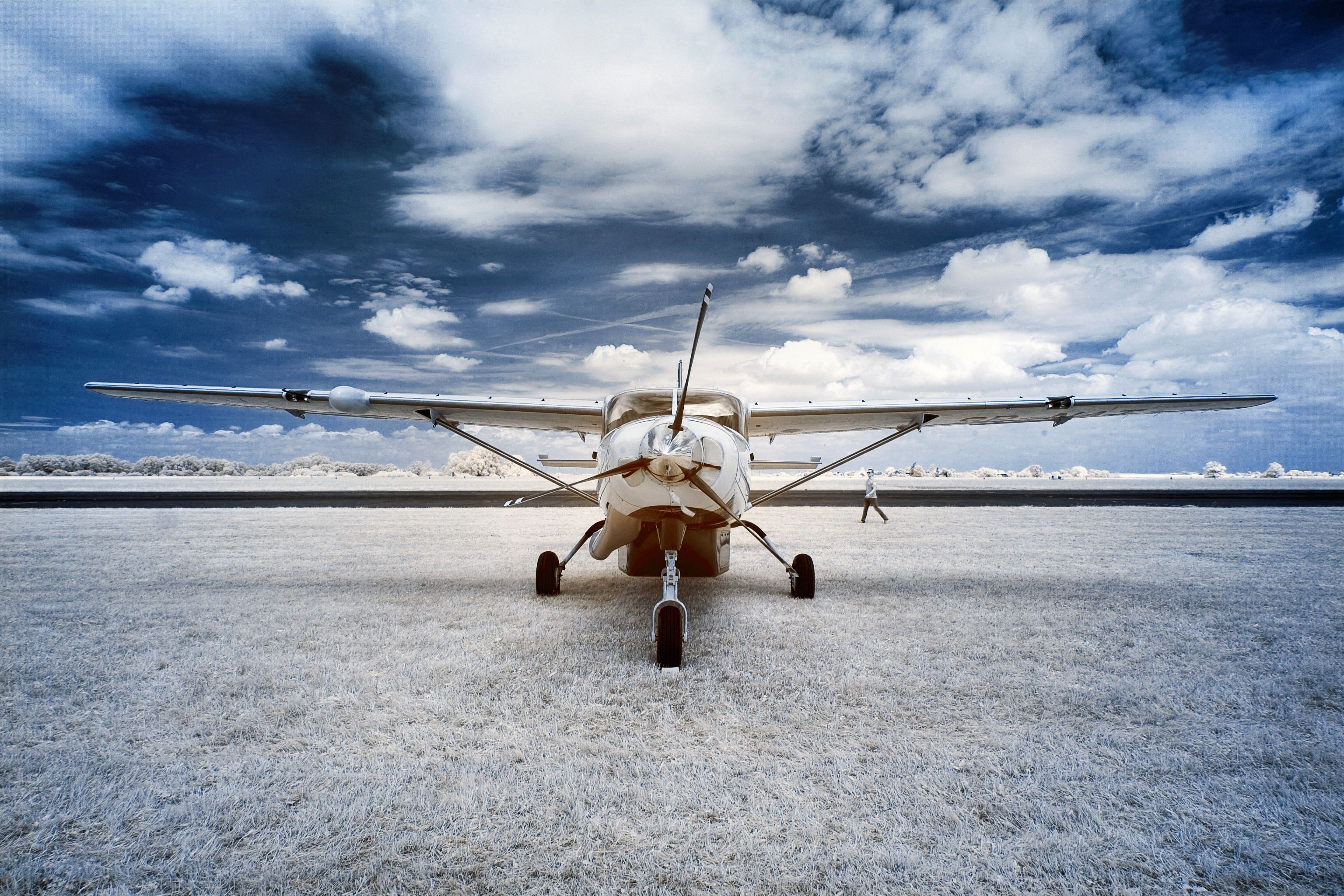 A general aviation aircraft parked on a snowy field.