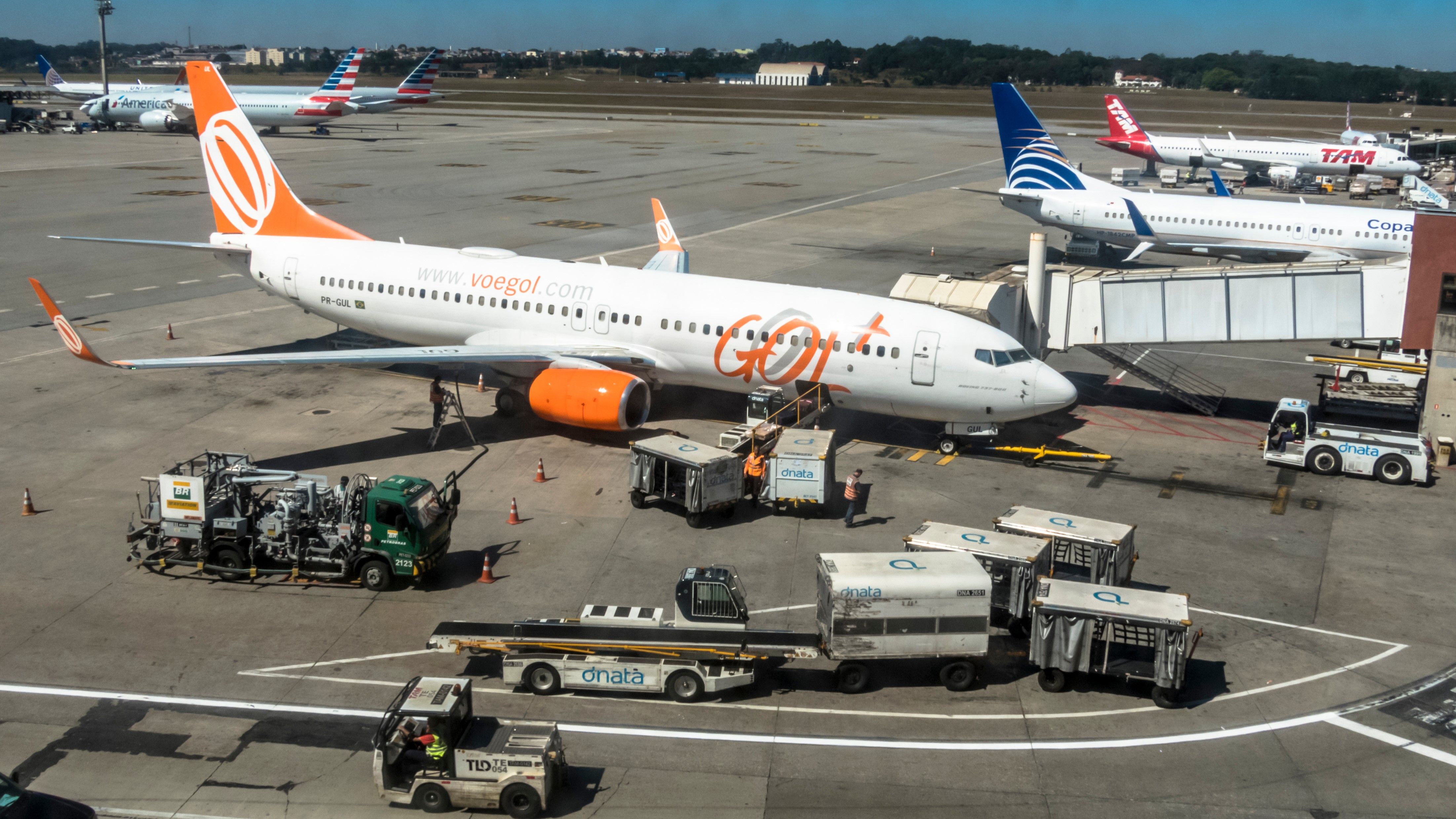 Aircraft from several different carriers parked at an airport.