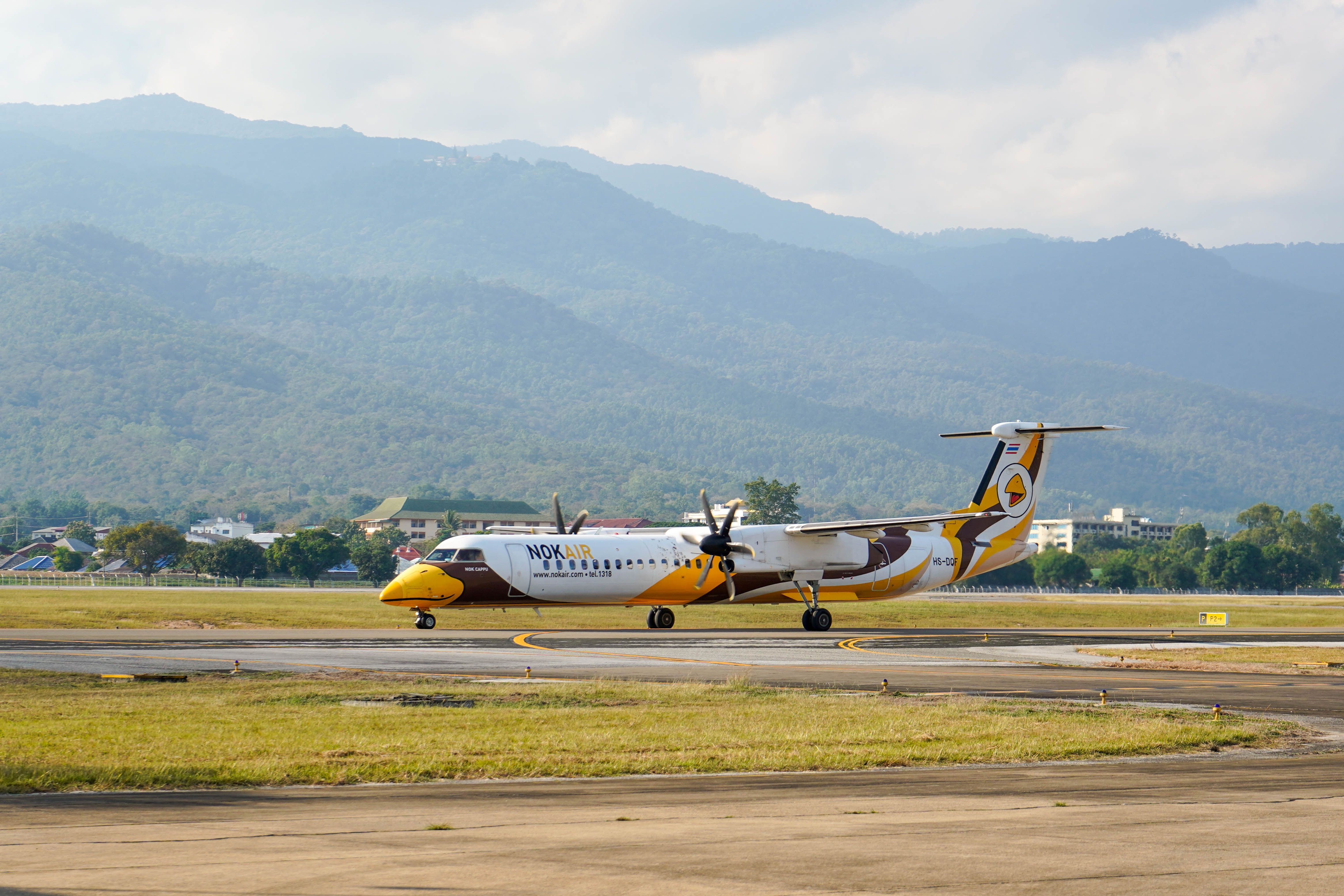 Nok Air Bombardier Dash-8 Q400 landing at Chiang Mai international airport.