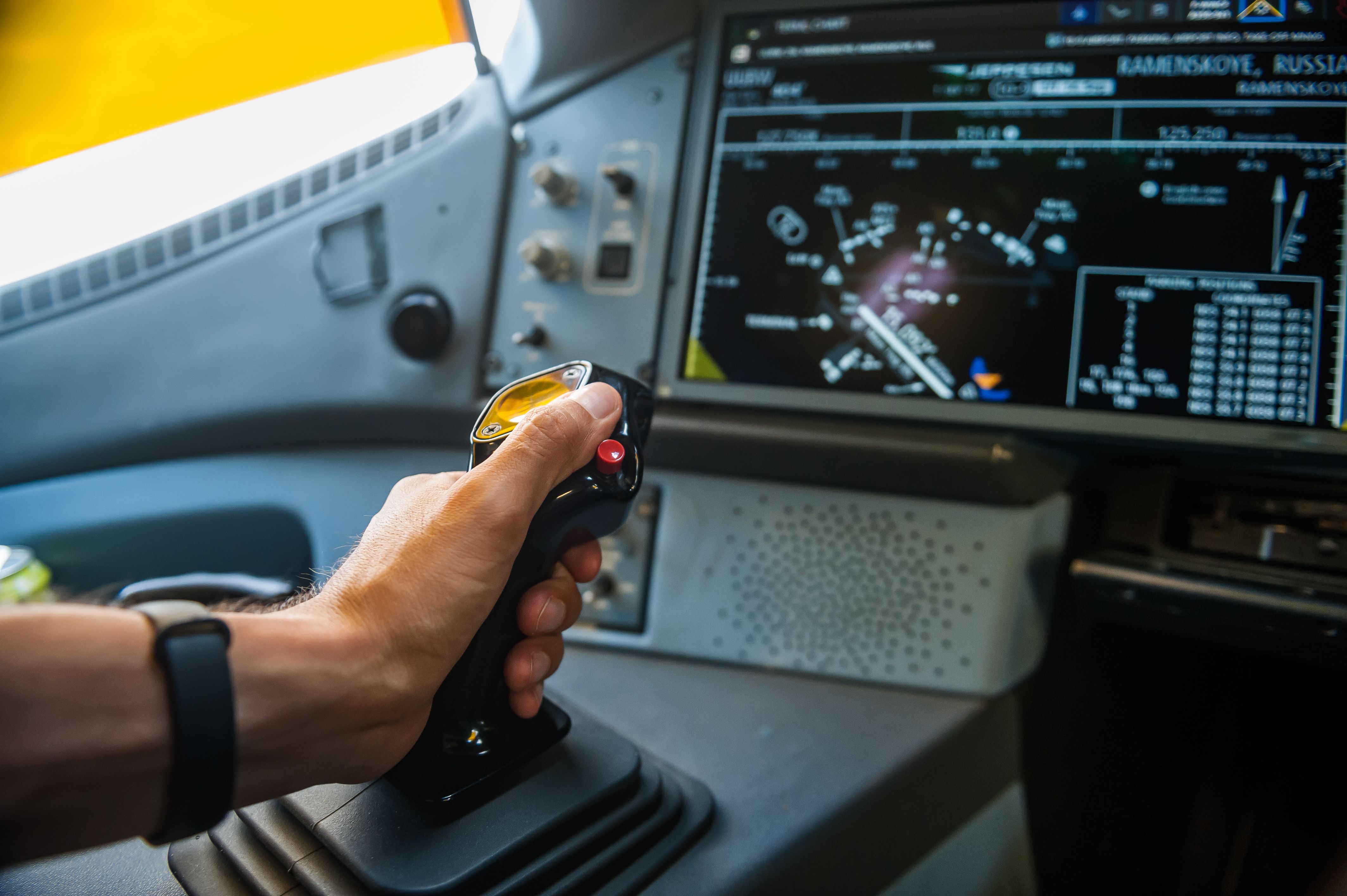 A hand on an Airbus aircraft side stick. 