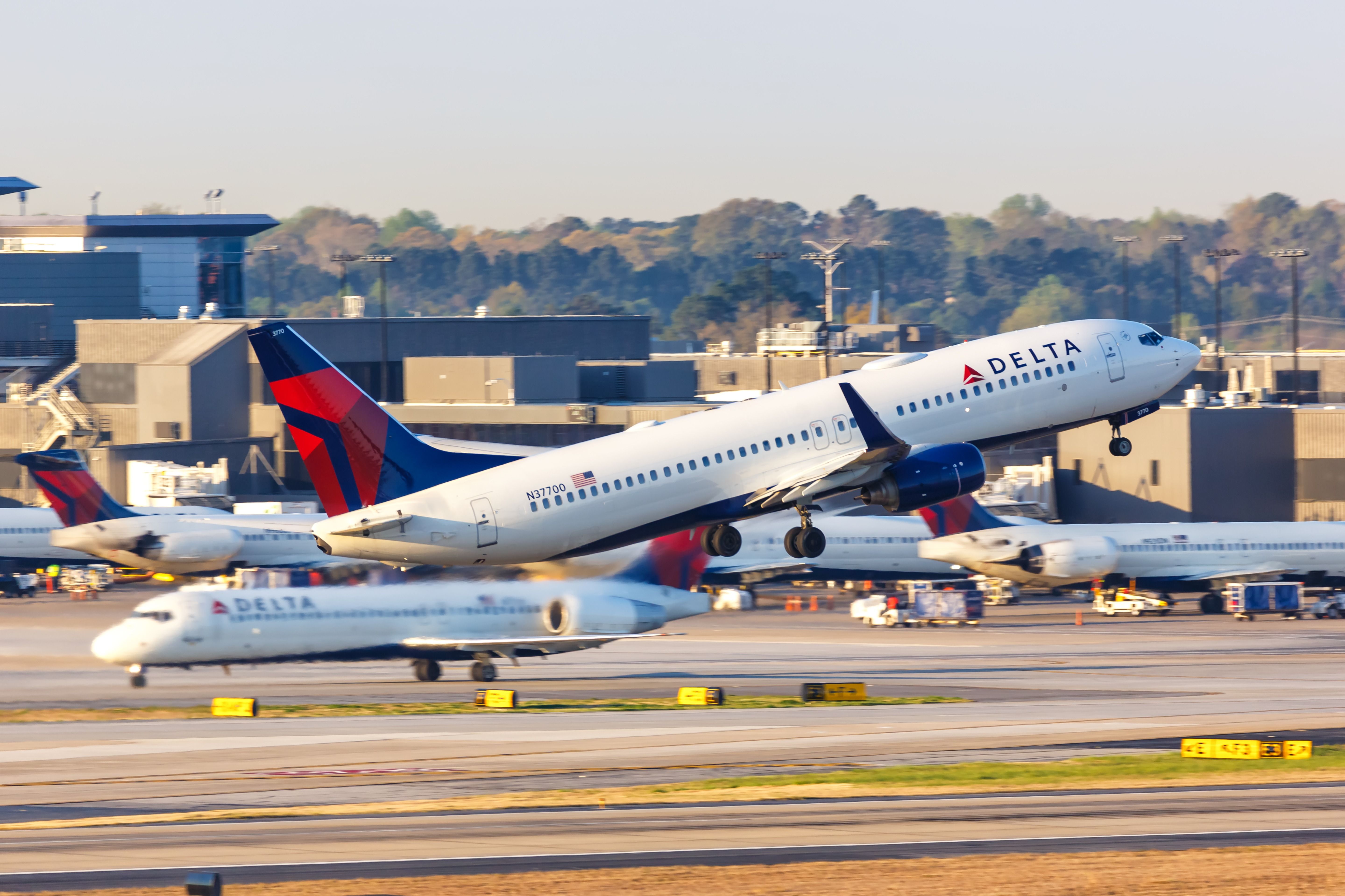Several Delta Air Lines aircraft at an airport.