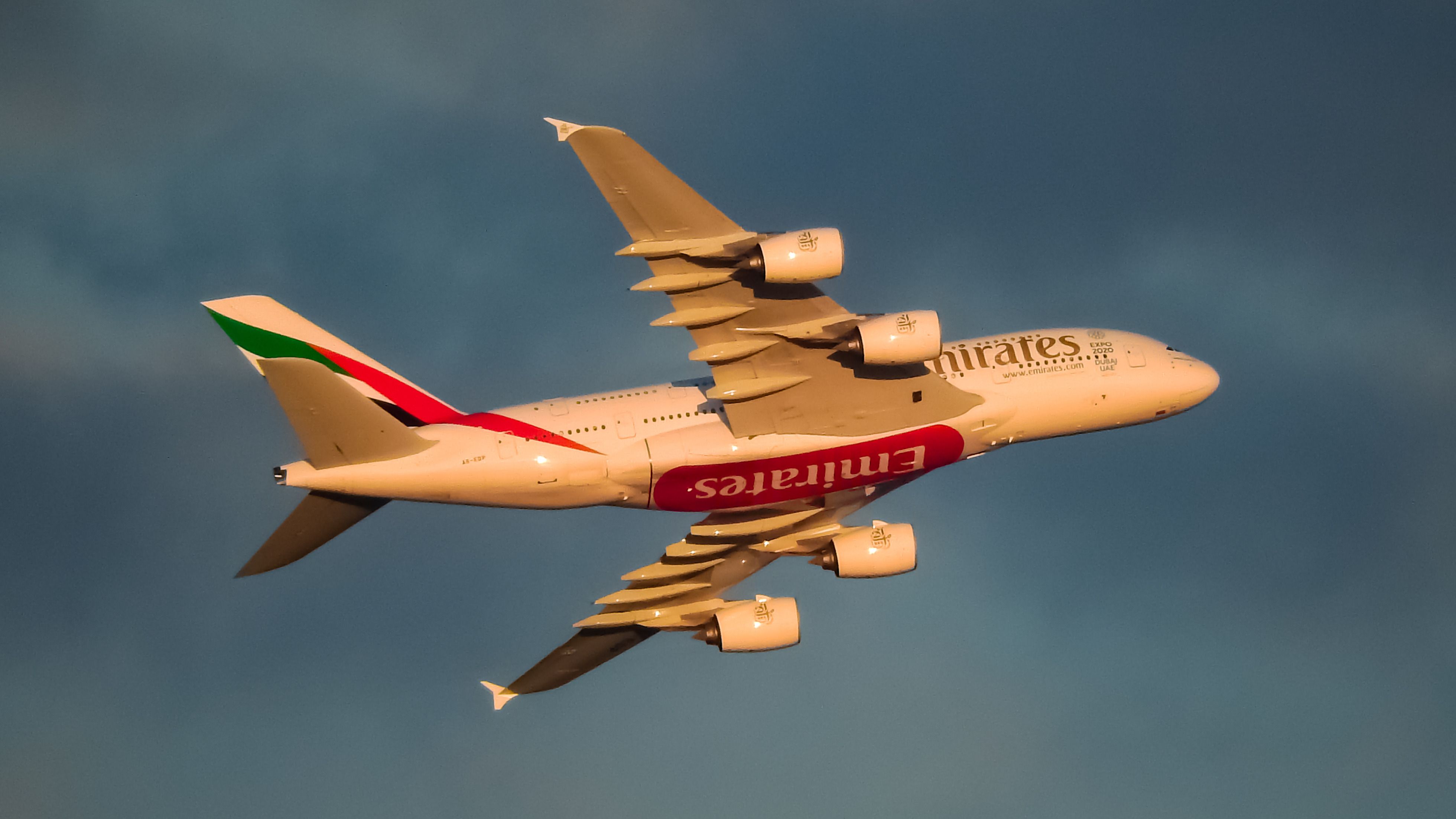 An Emirates Airbus A380-800 flying in the sky.