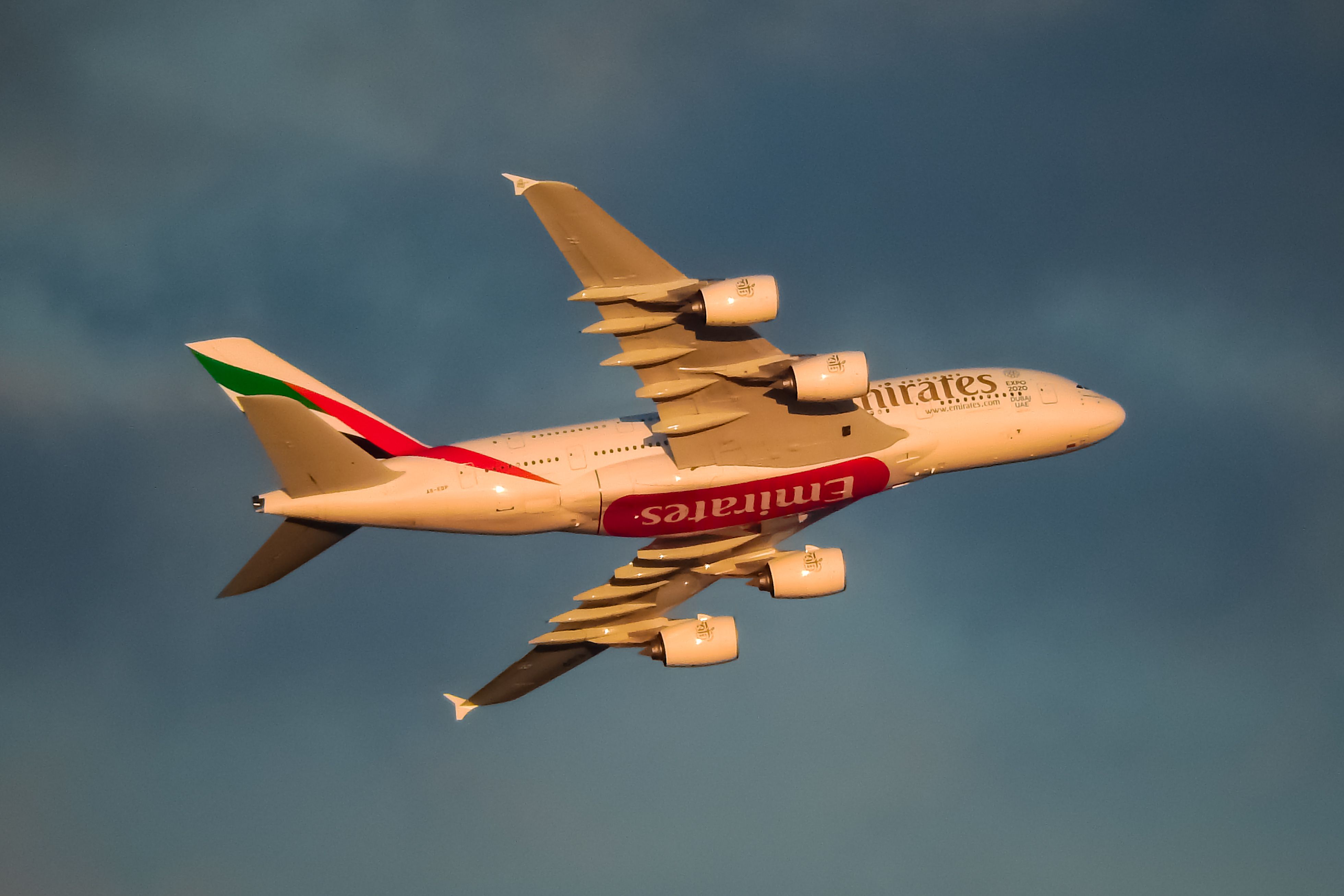 An Emirates Airbus A380-800 flying in the sky.