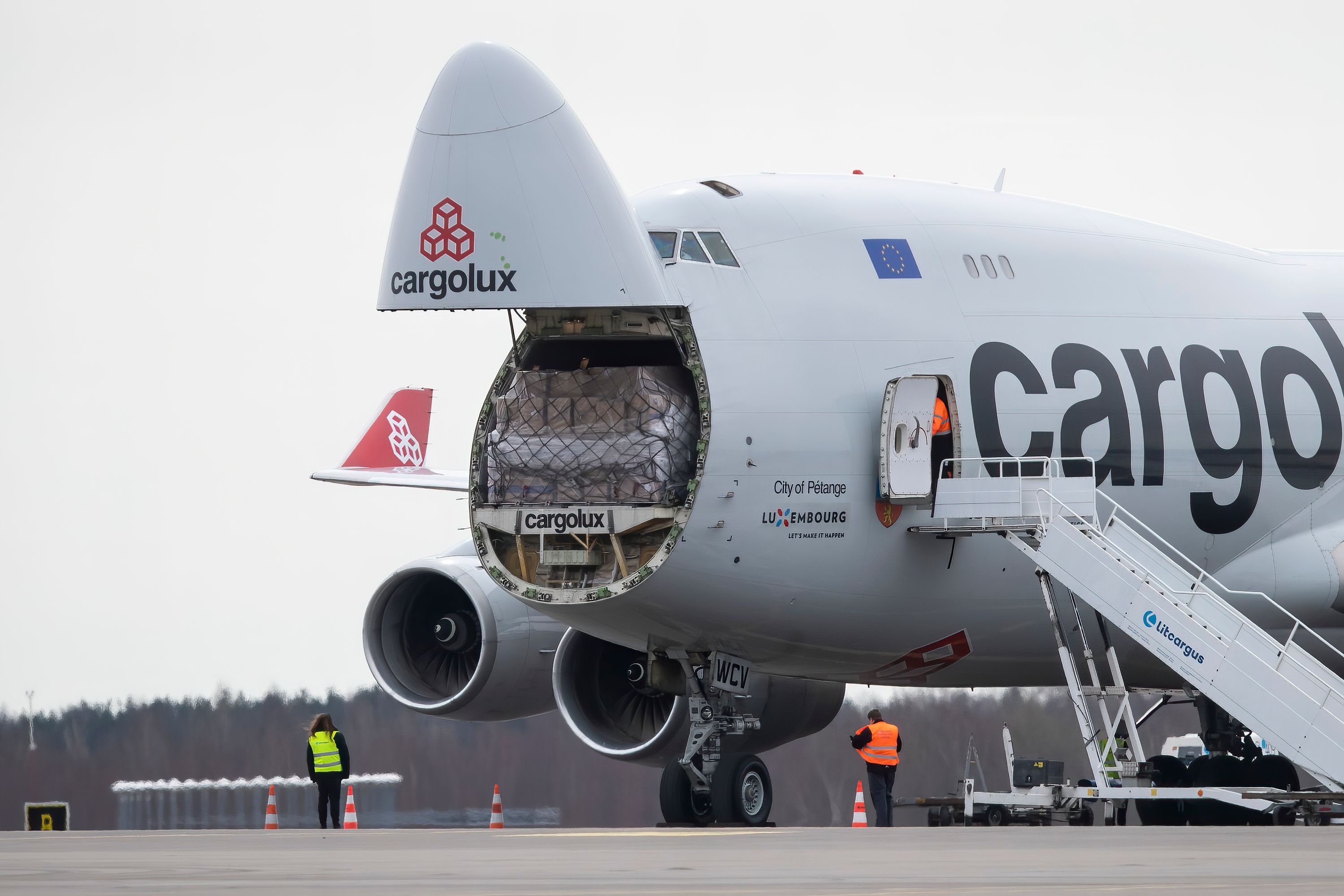 A CargoLux Boeing 747-400F with its nose door open.