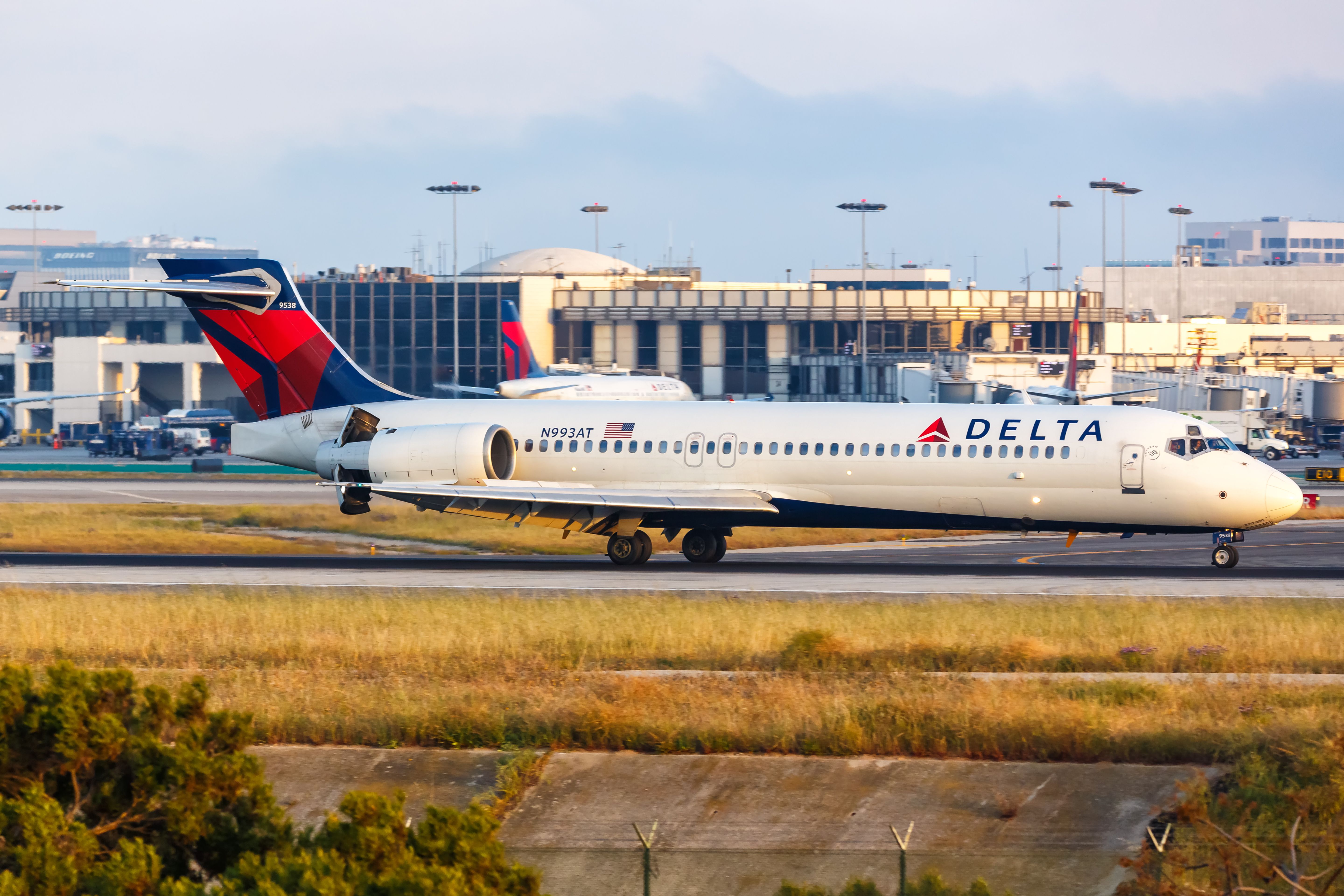 A Delta Air Lines Boeing 717 on an airport apron.