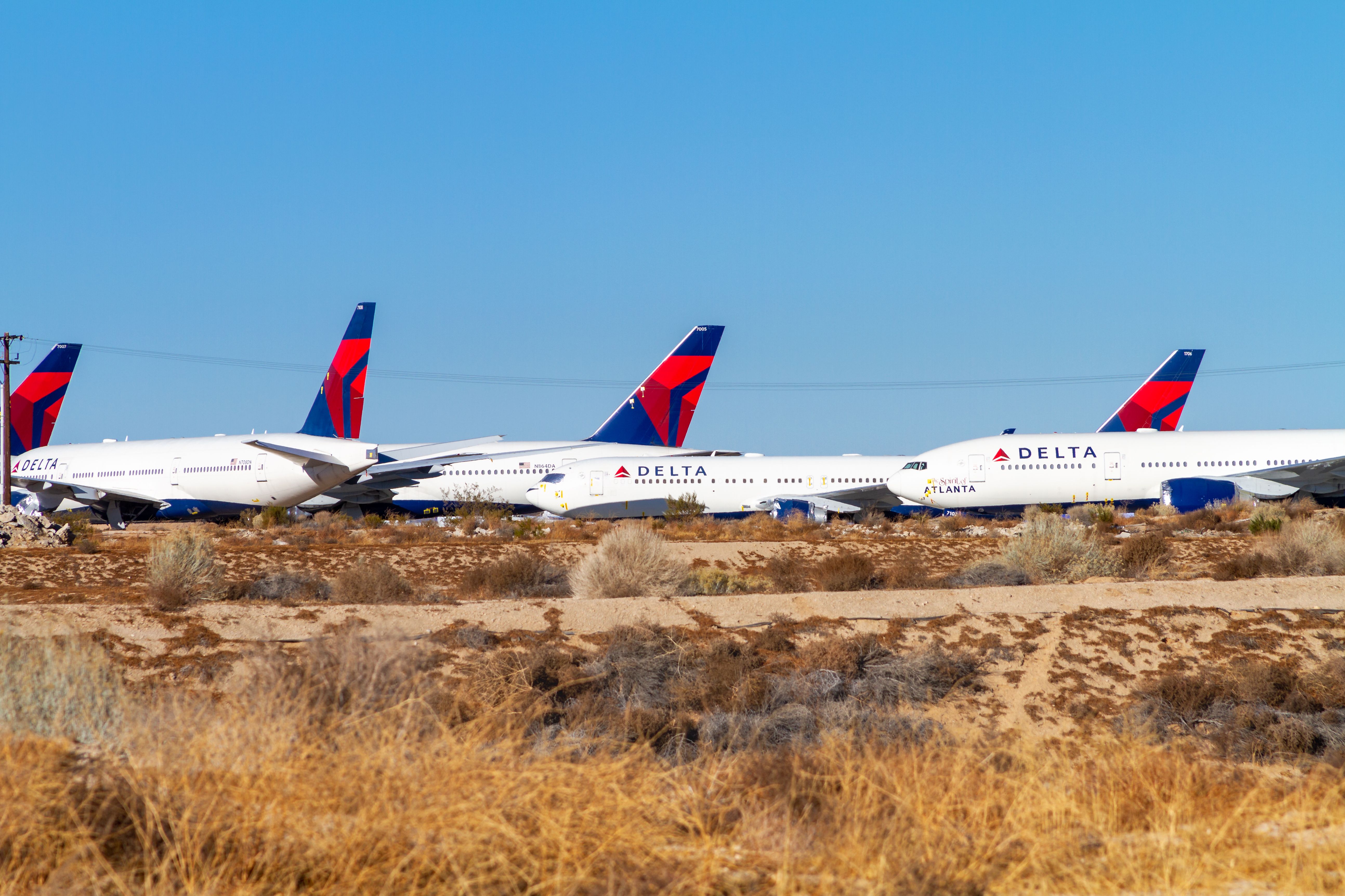 shutterstock_1881142513 - Victorville, CA, USA – December 22, 2020: Delta Airlines aircrafts are parked at Southern California Logistics Airport in Victorville, California, due to the COVID-19 crisis.