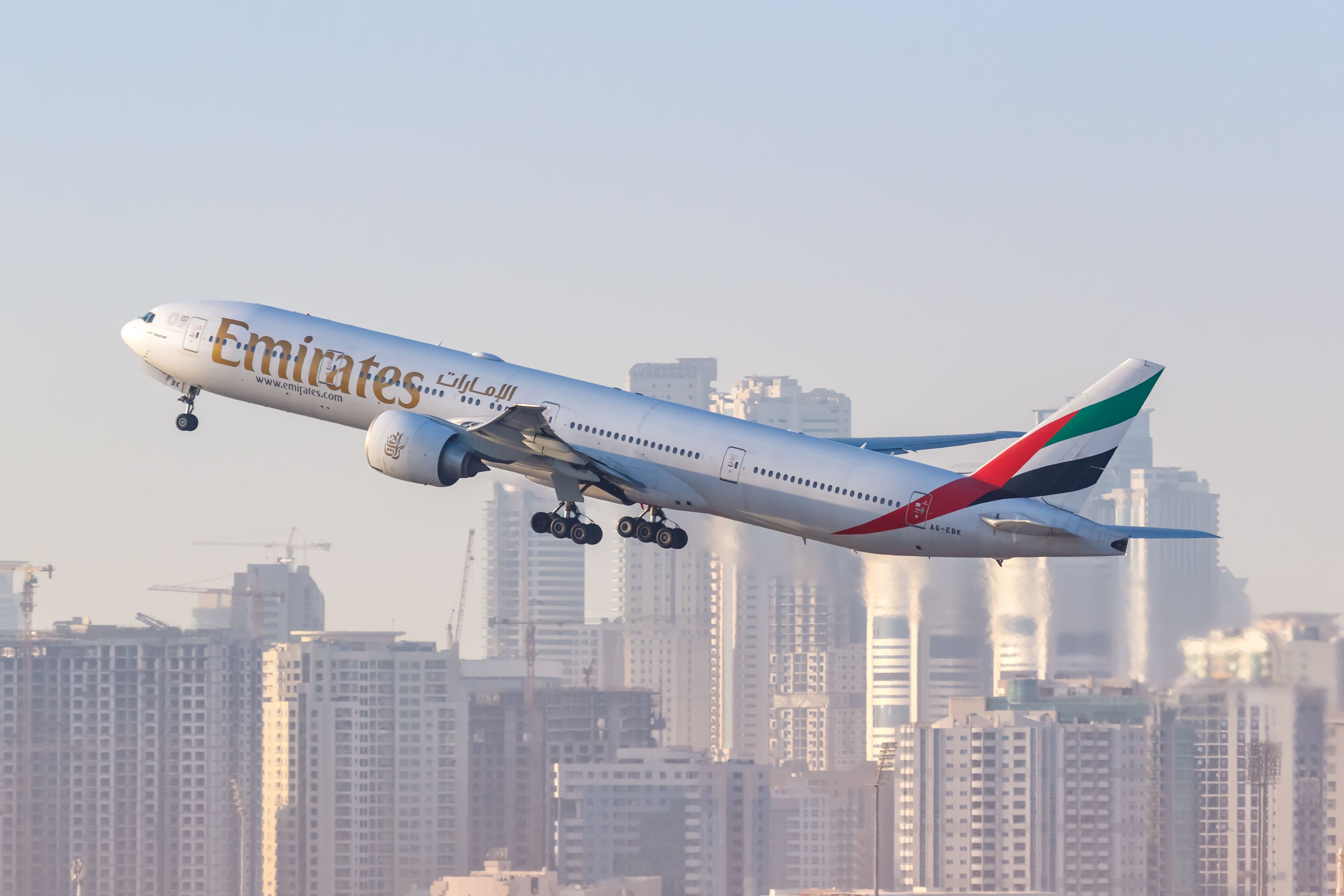 Emirates Boeing 777-300ER airplane at Dubai airport (DXB) in the United Arab Emirates.