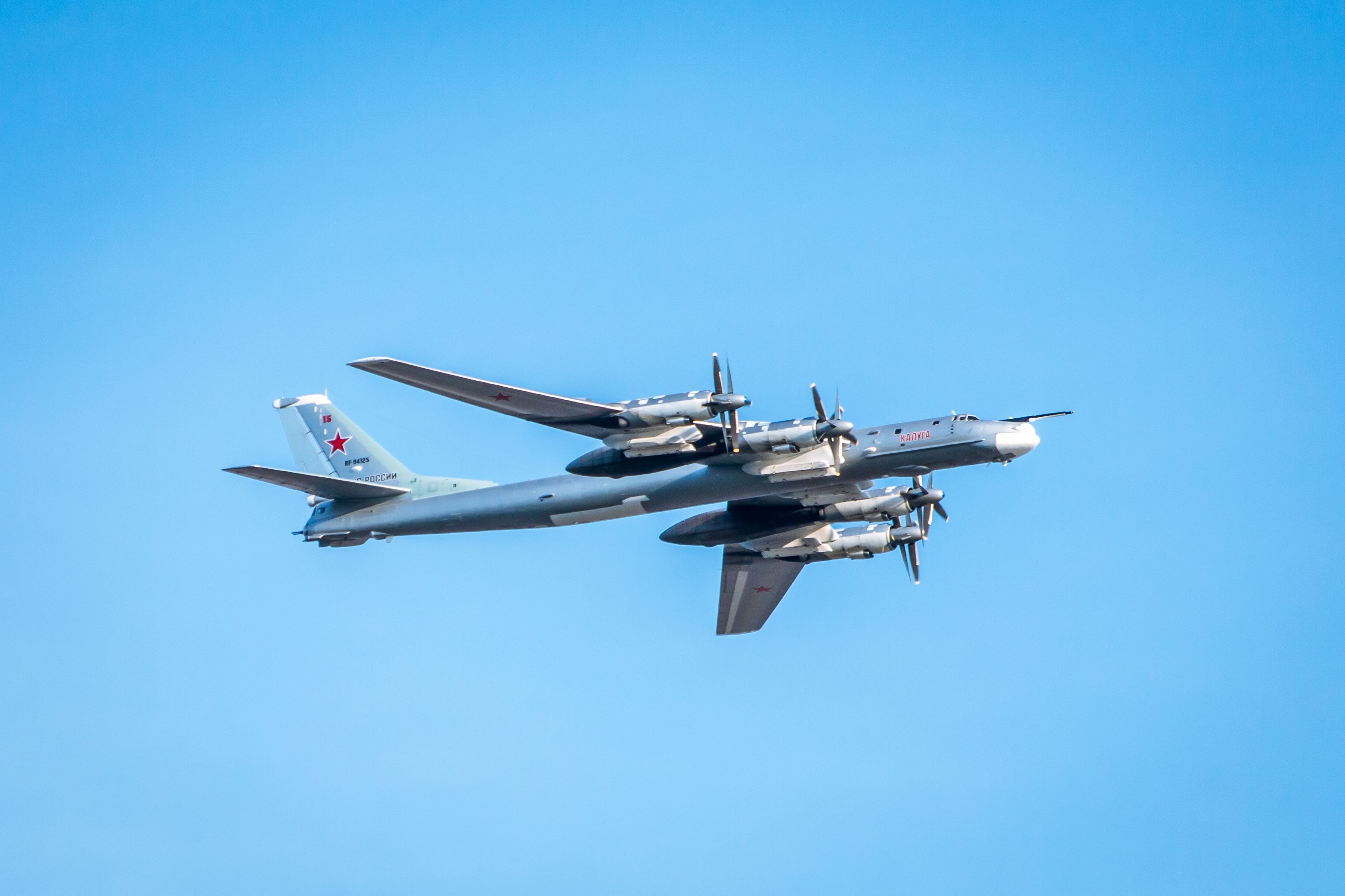 A Tupolev Tu-95 flying in the sky.