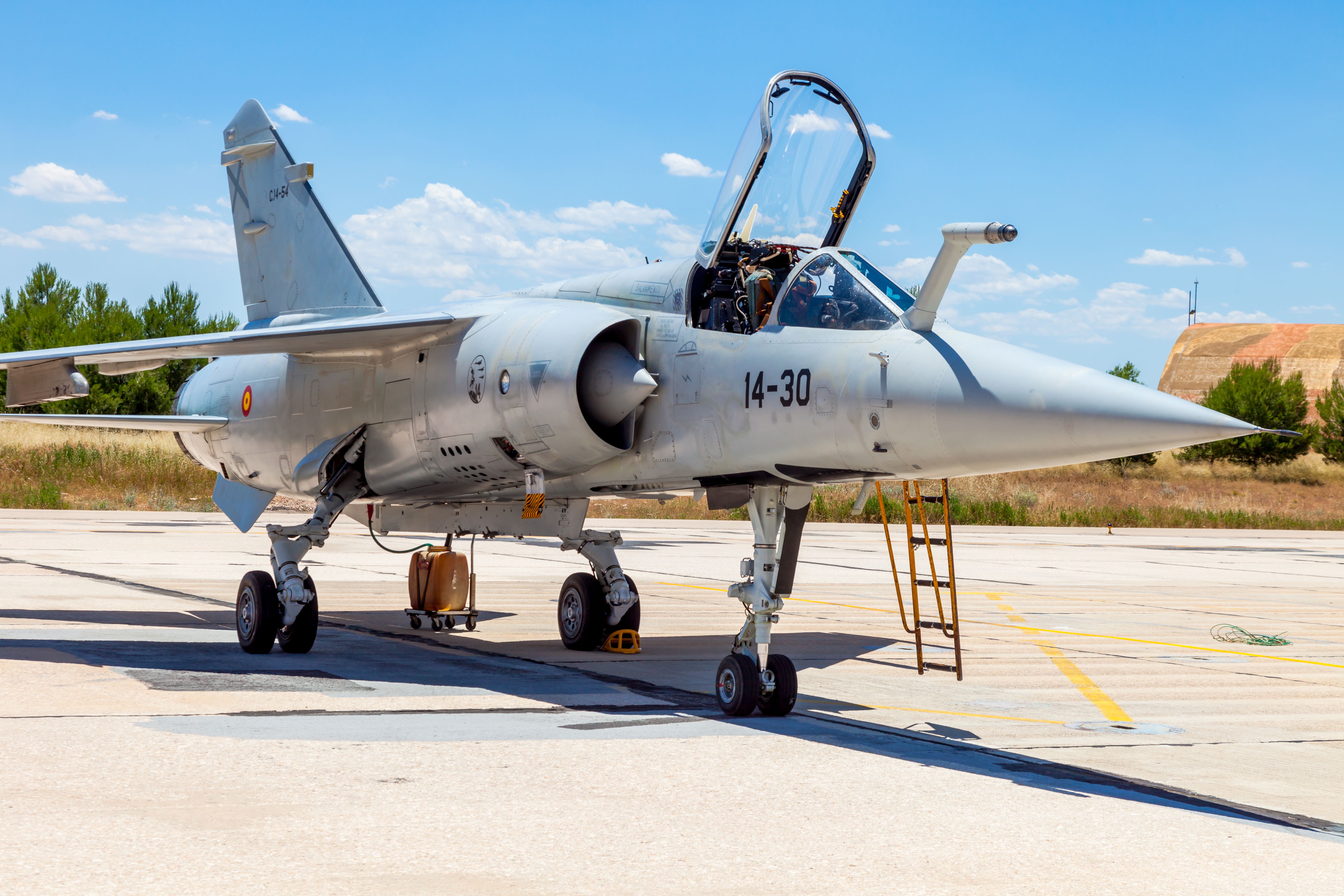 A Dassault Mirage F1 parked at an airfield.