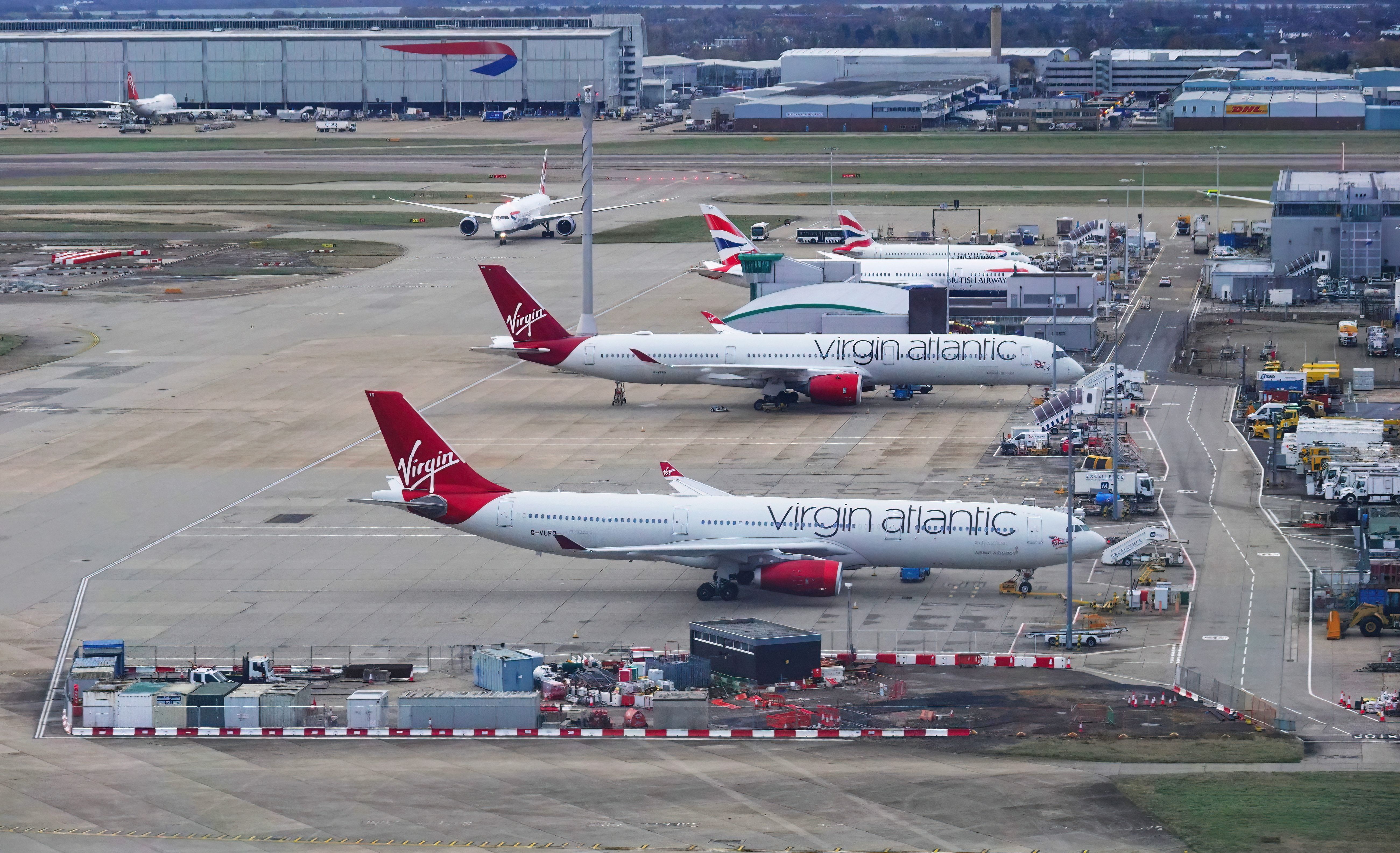 shutterstock_2158627773 - Dec 05, 2021: A high angle view of Virgin Atlantic and British Airways aeroplanes on the ground at London Heathrow airport