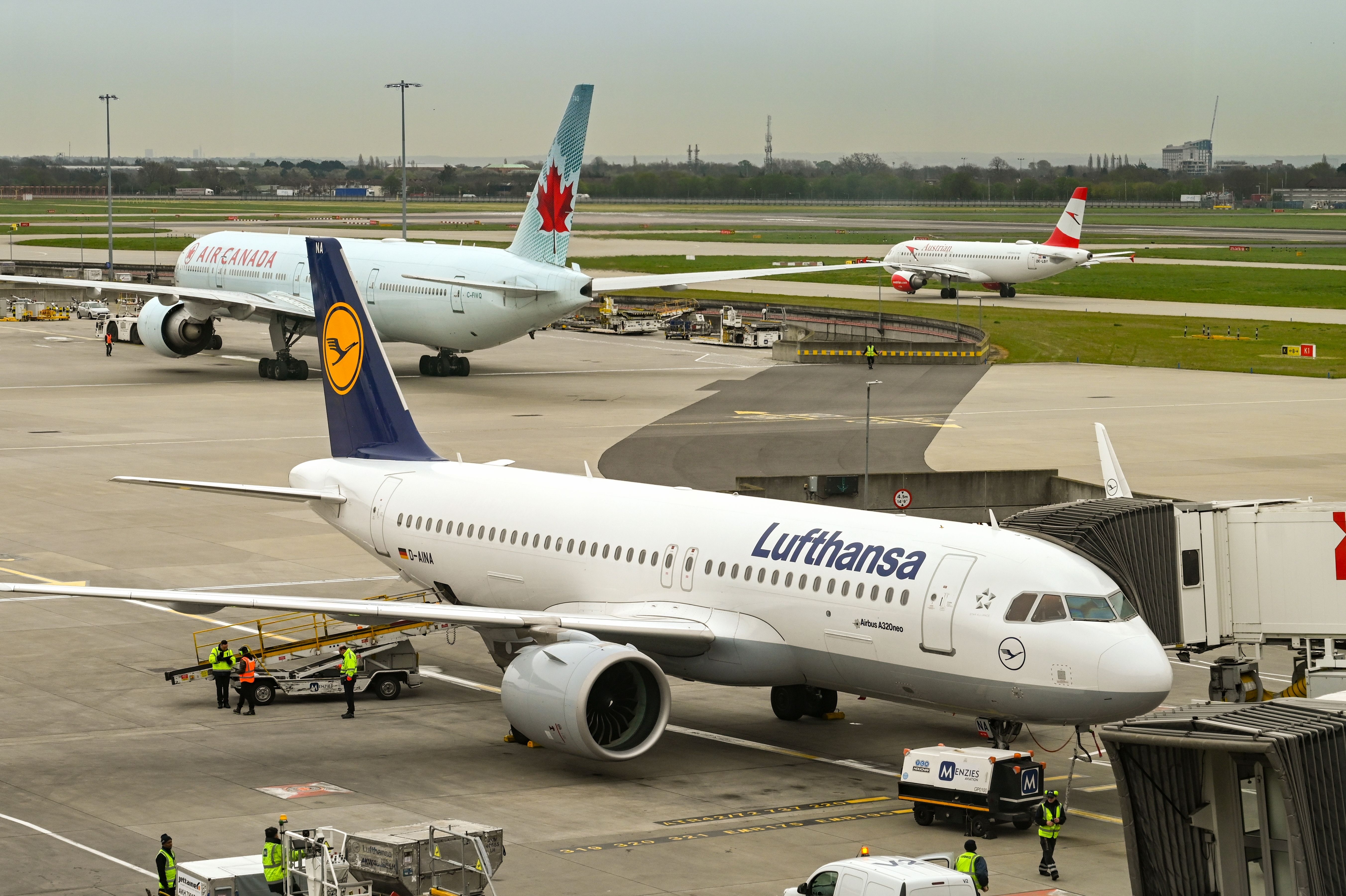 Lufthansa Airbus A320neo Parked At London Heathrow Airport With Air Canada & Austrian Airlines Planes In The Background