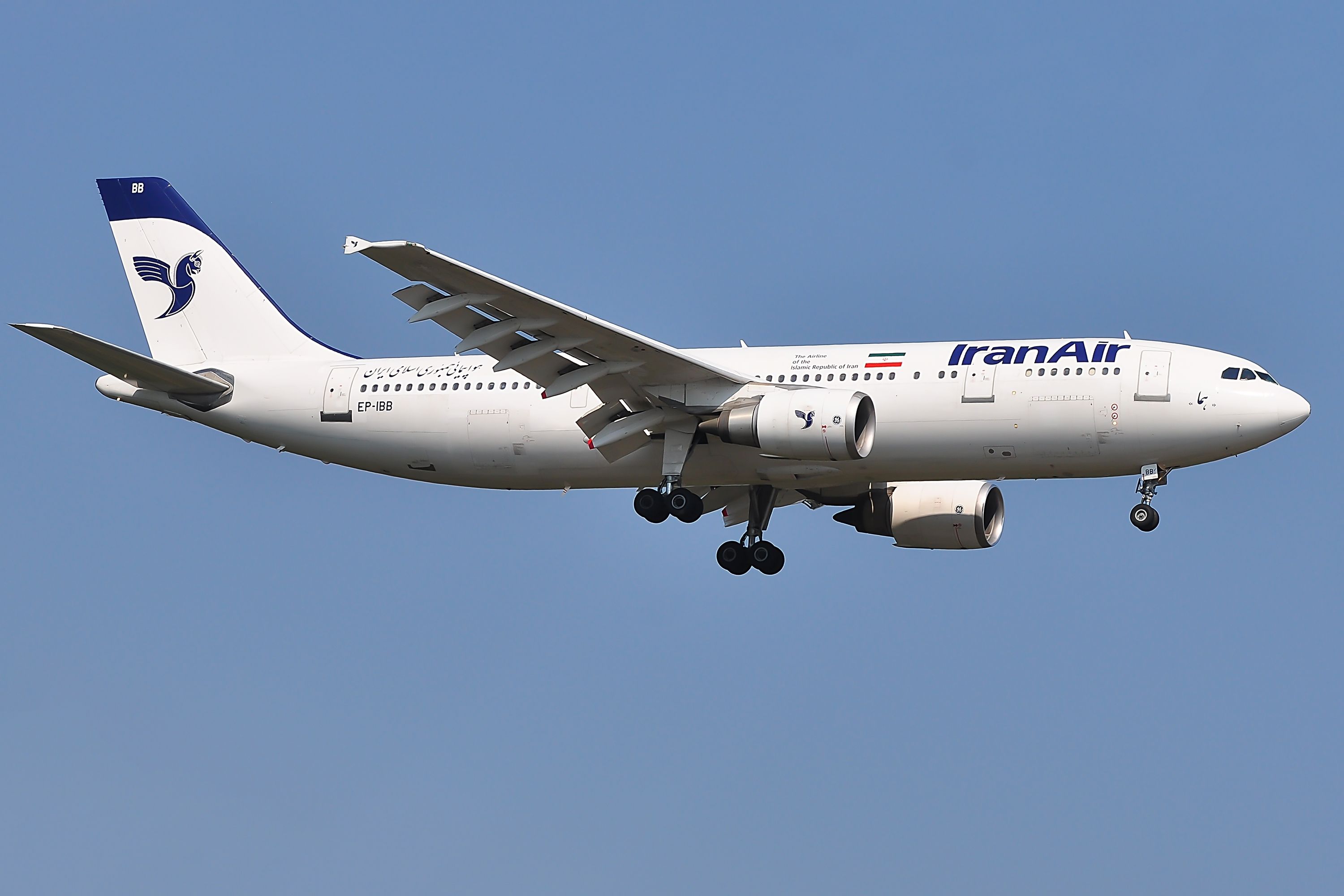 An IranAir Airbus A300-600 flying in the sky.