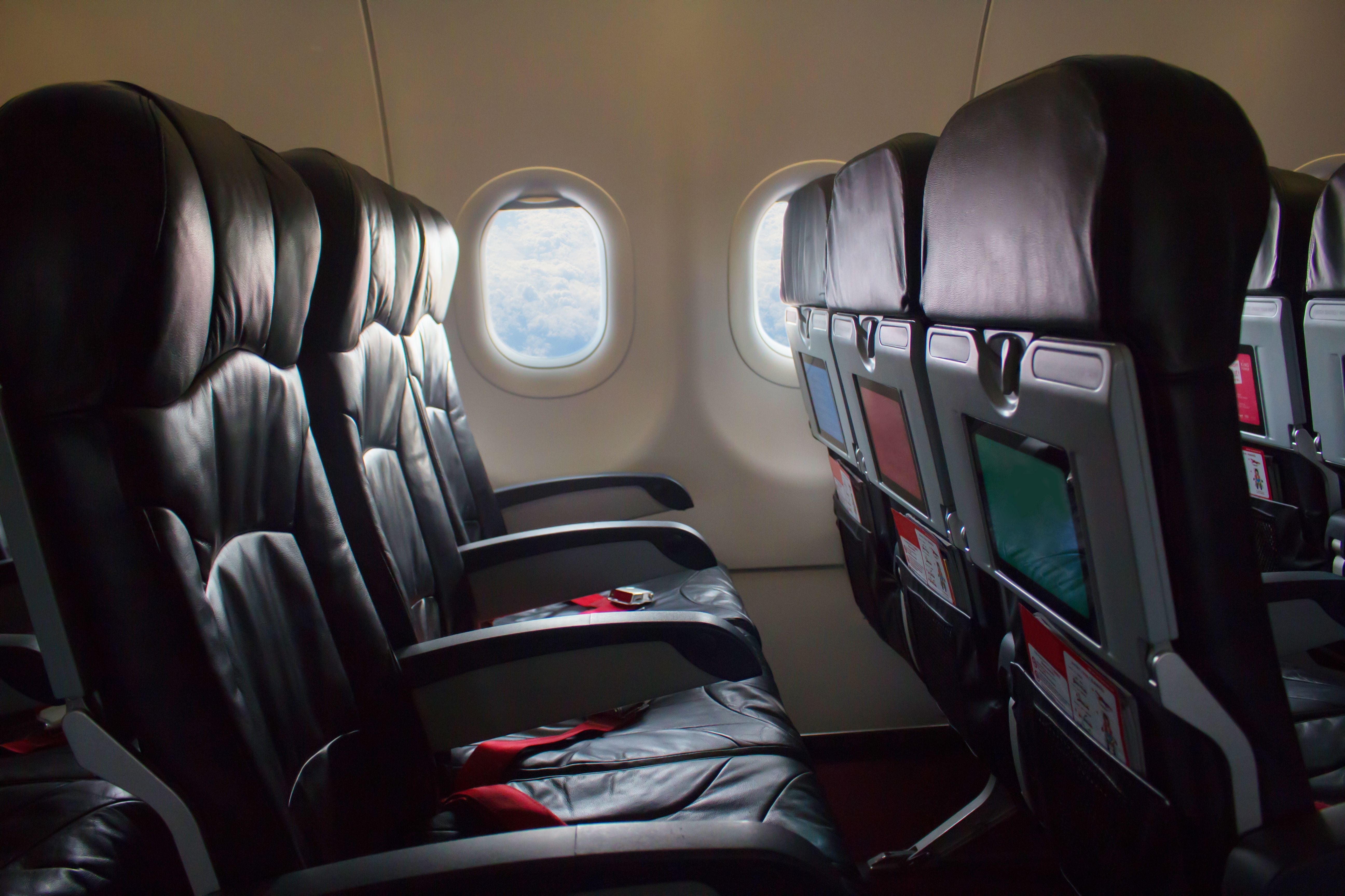 An Empty Row Of Economy Class Seats on an aircraft.