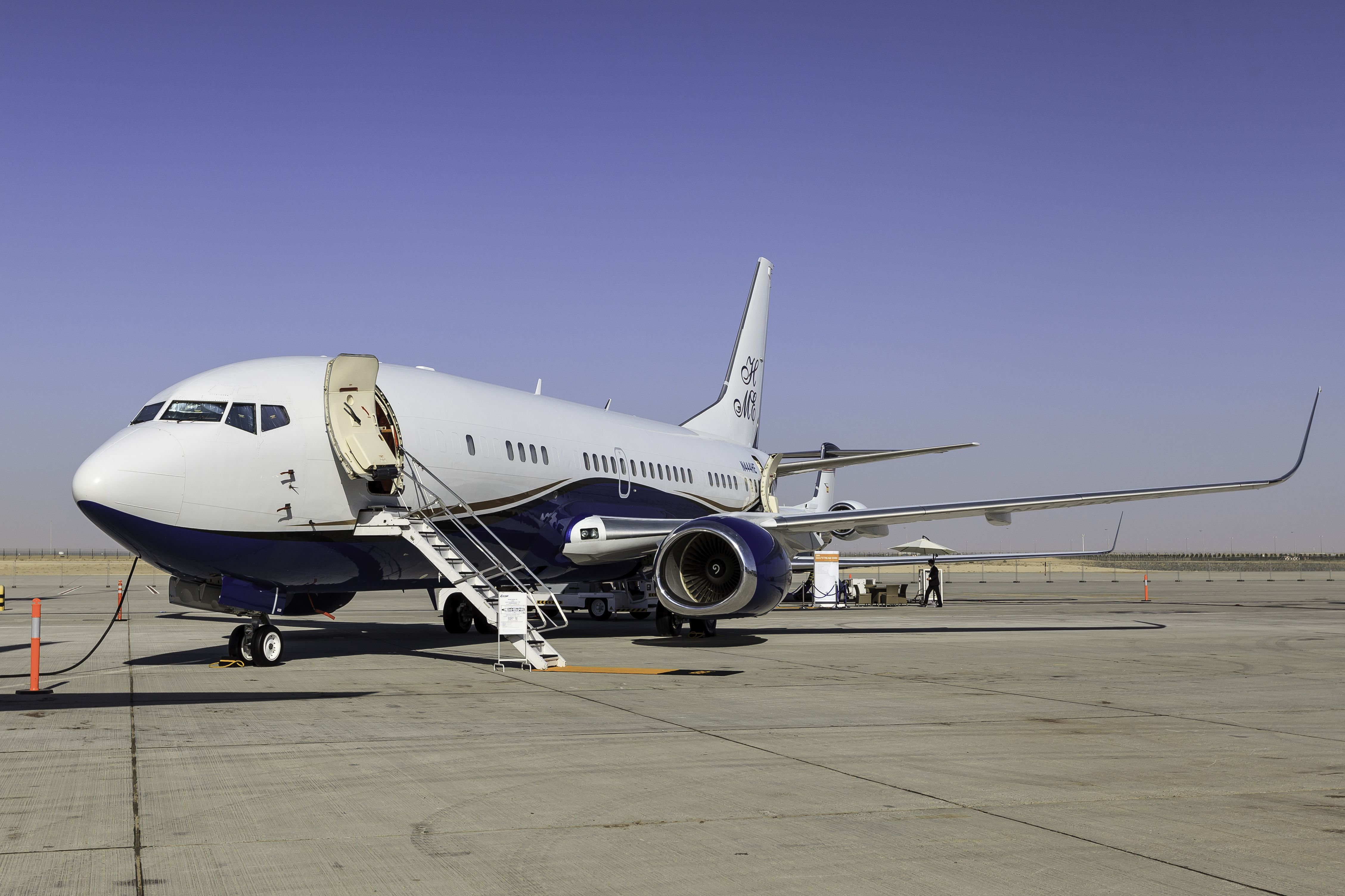 A Boeing BBJ 737 parked at an airport.