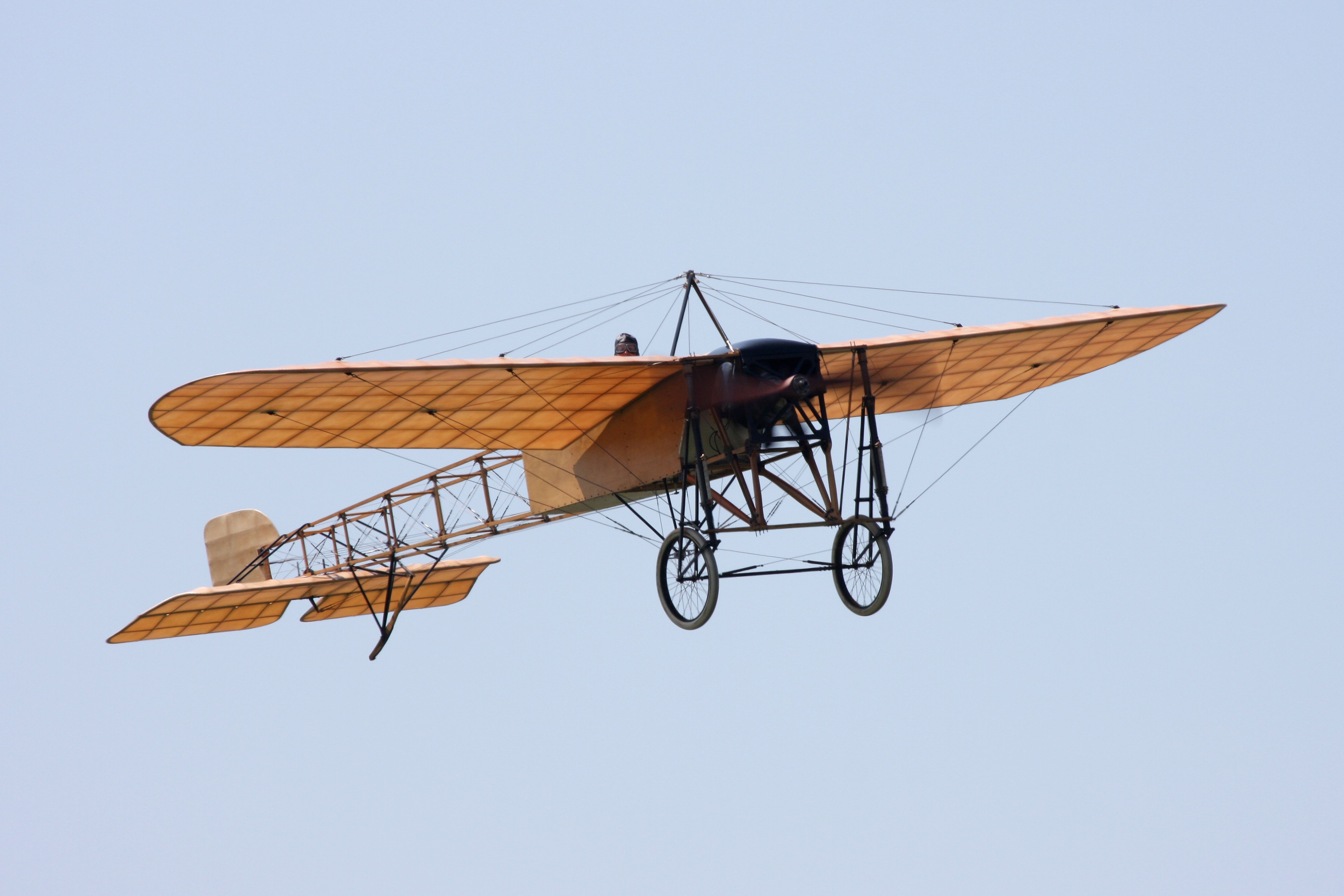 A Bleriot XI flying in the sky.