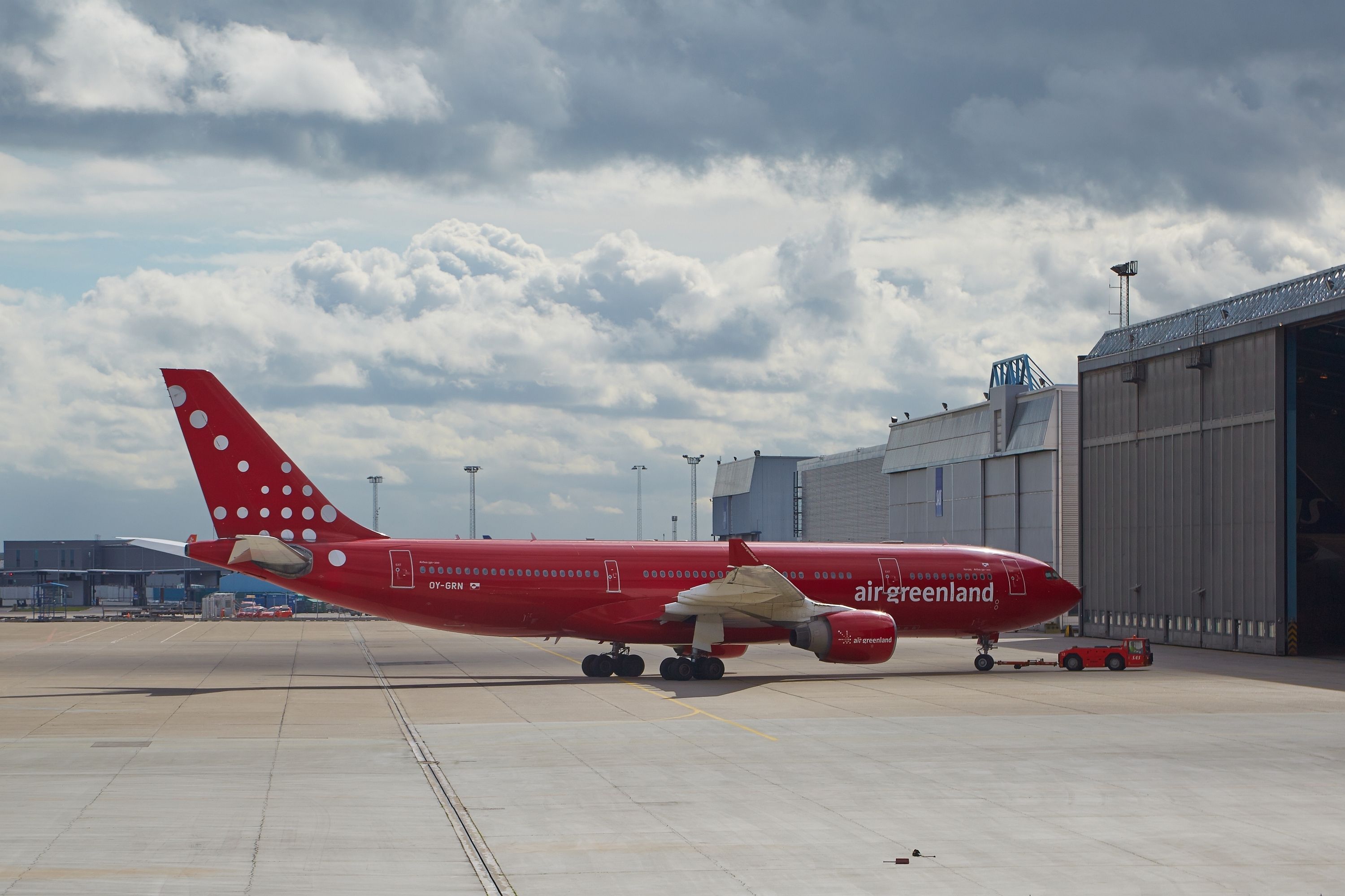 Air Greenland A330 towed into hangar at Kastrup Airport, May 13th 2015. This Airbus A330 is the largest airliner of Air Greenland.