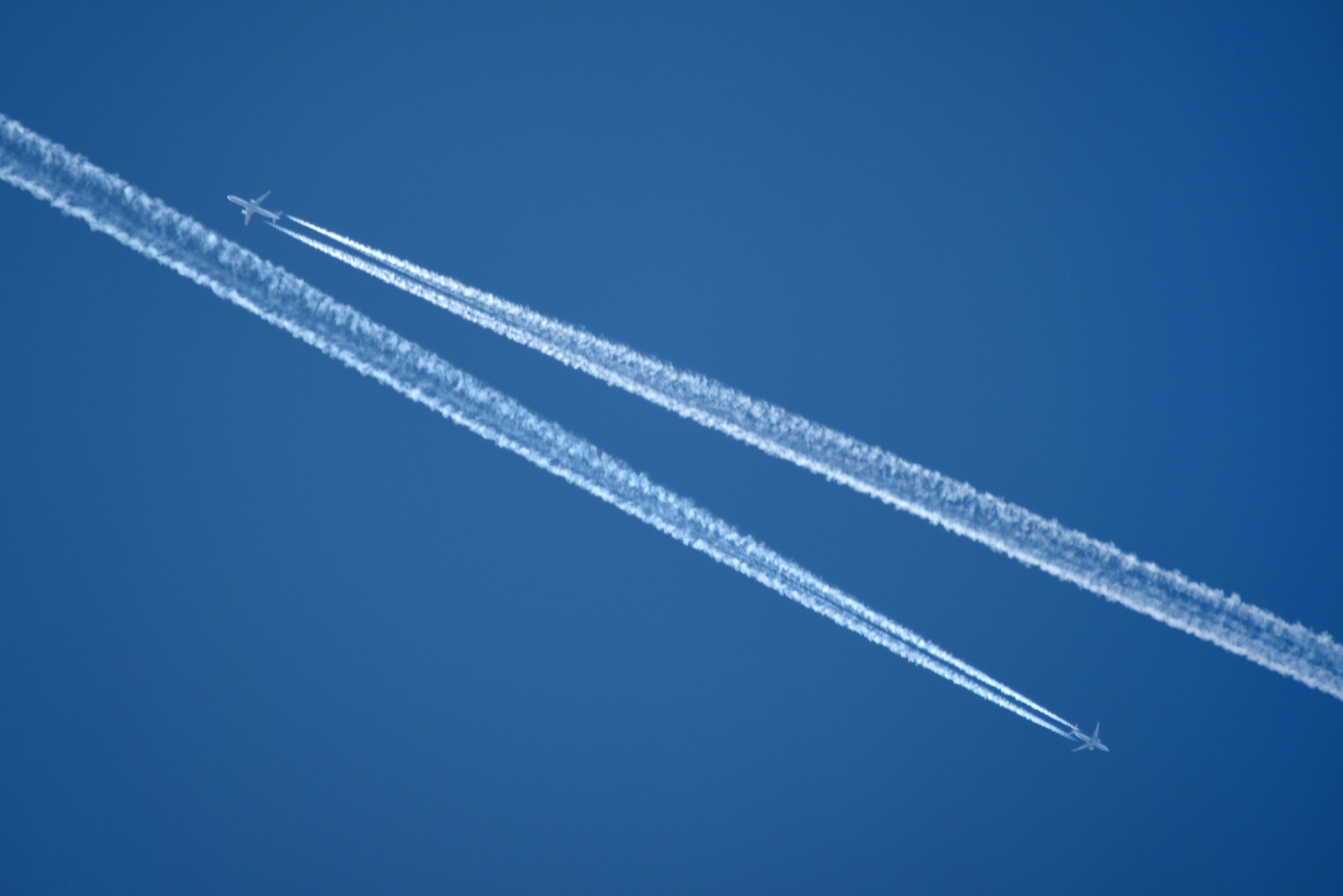 Contrails in the sky of two planes that passed each other in cruise.