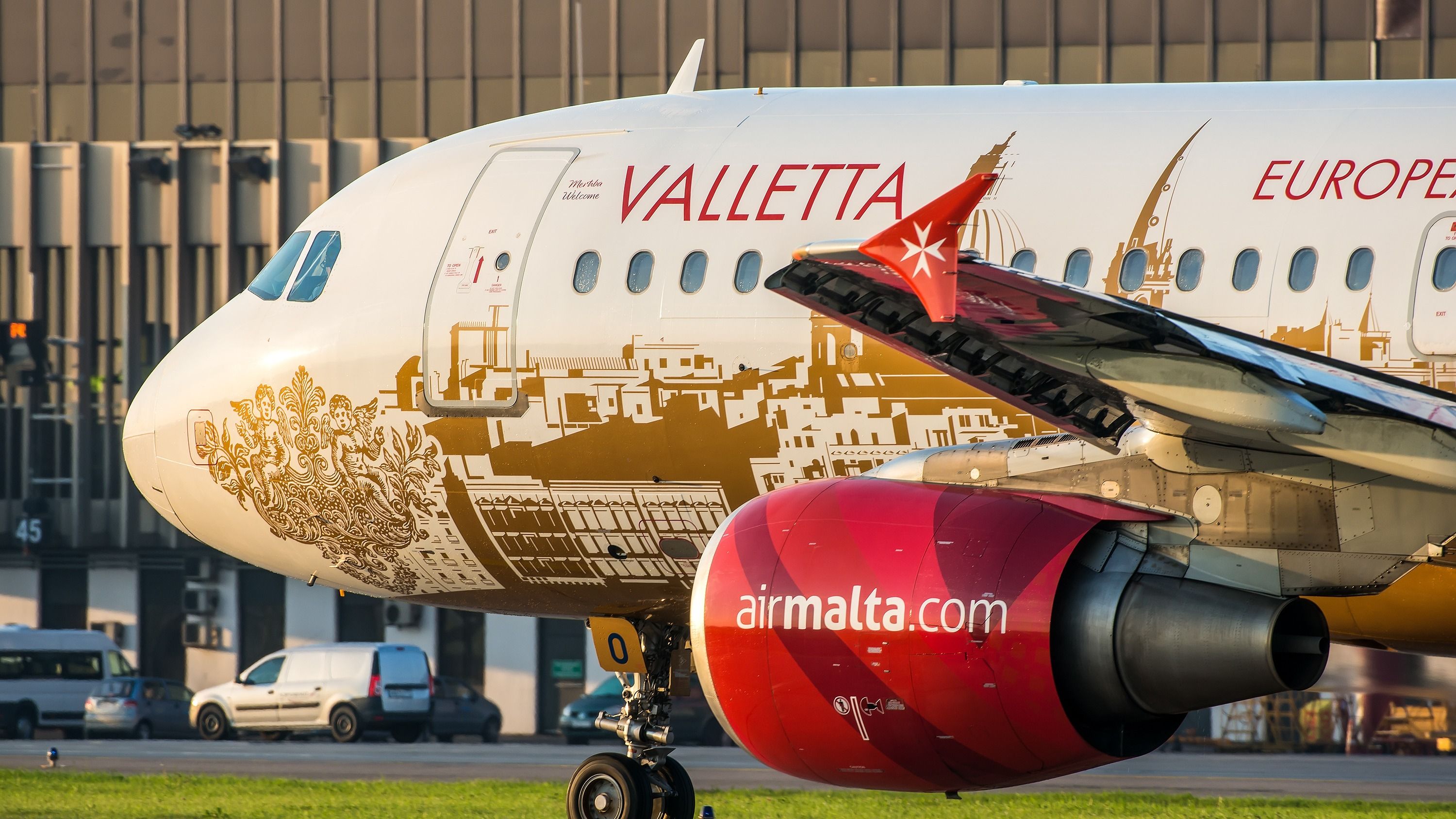 An Air Malta Airbus A320 parked at an airport