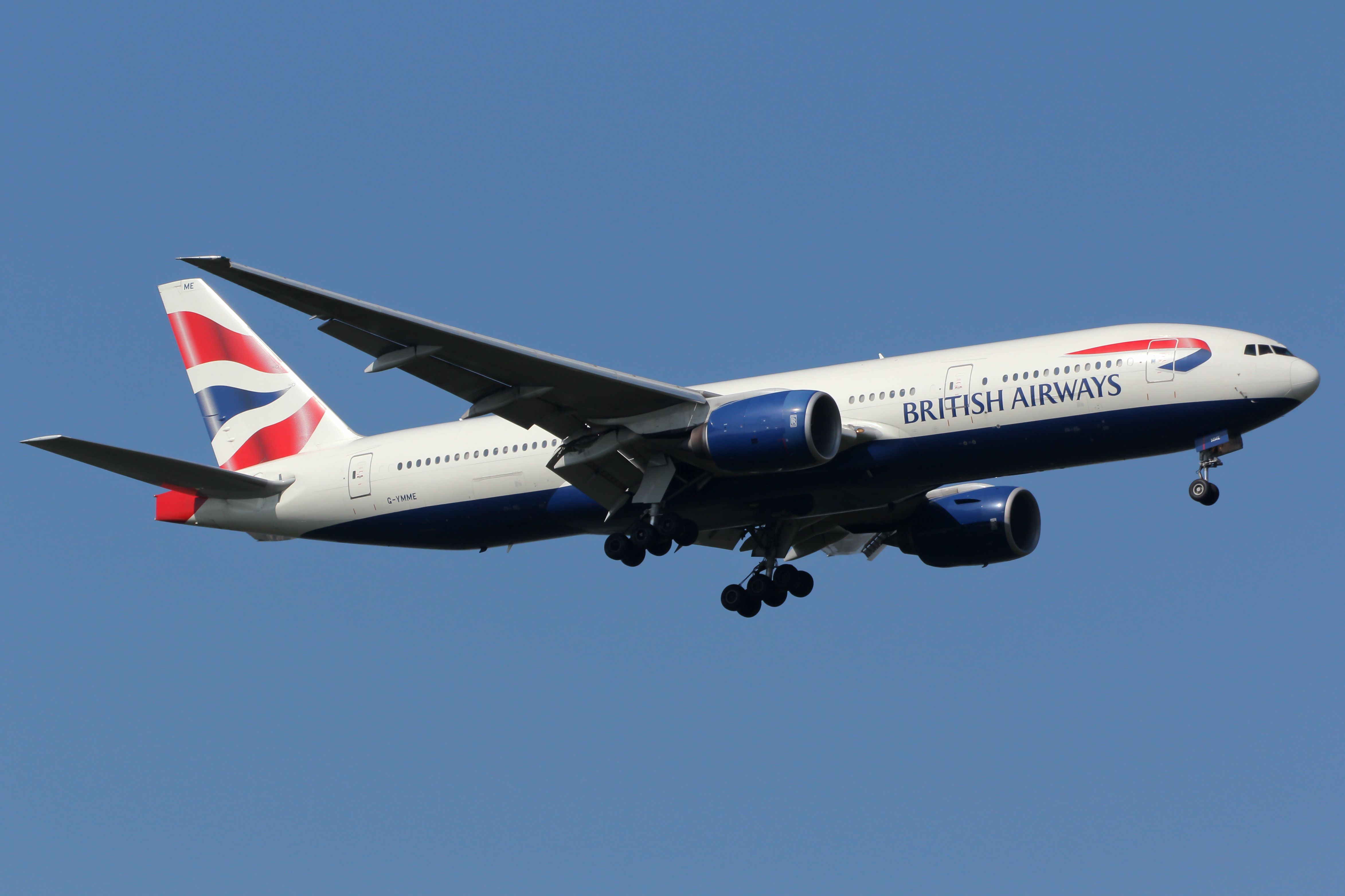 A British Airways Boeing 777-200 flying in the sky.