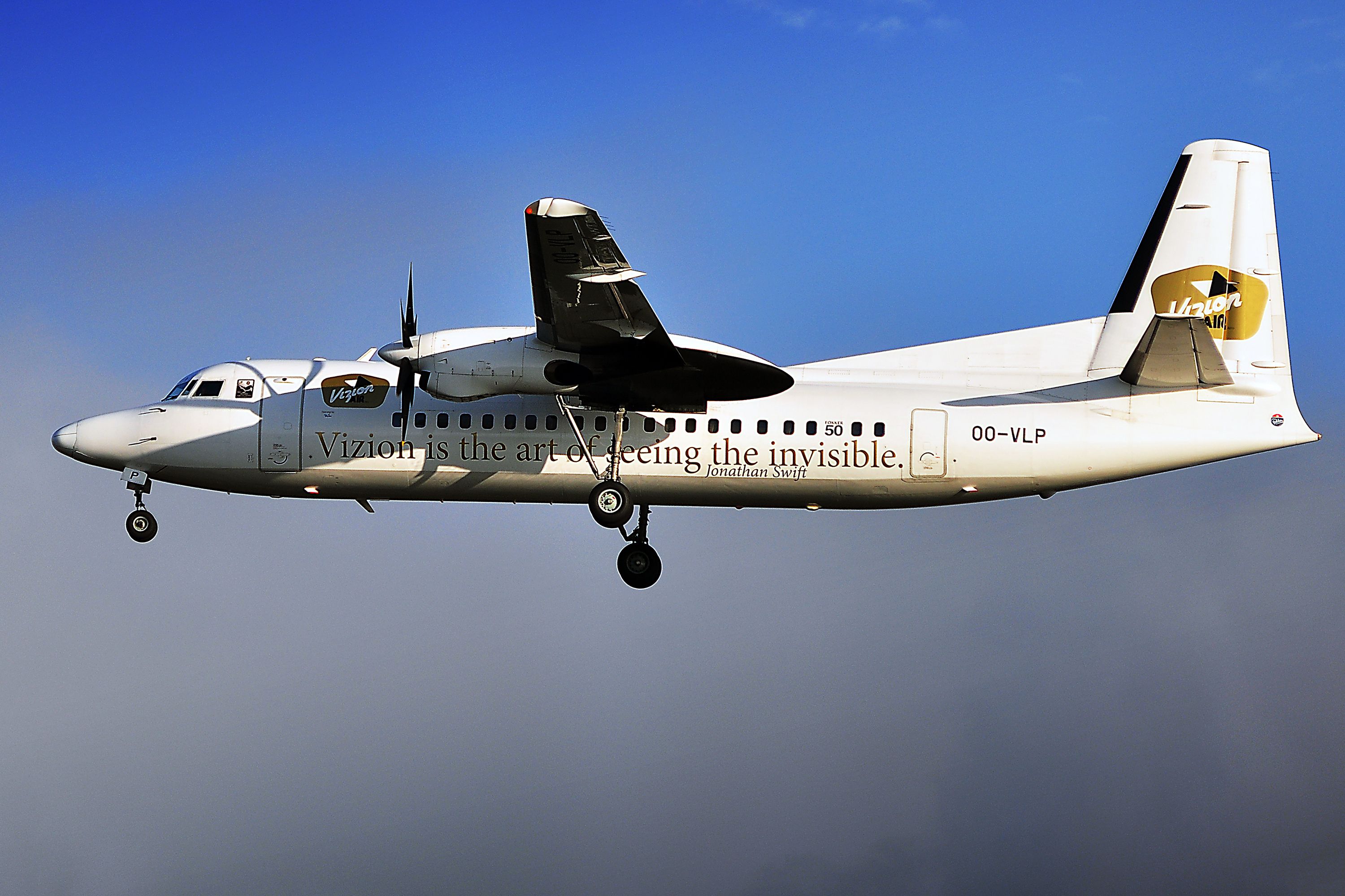A Vizion Air turboprop flying in the sky.