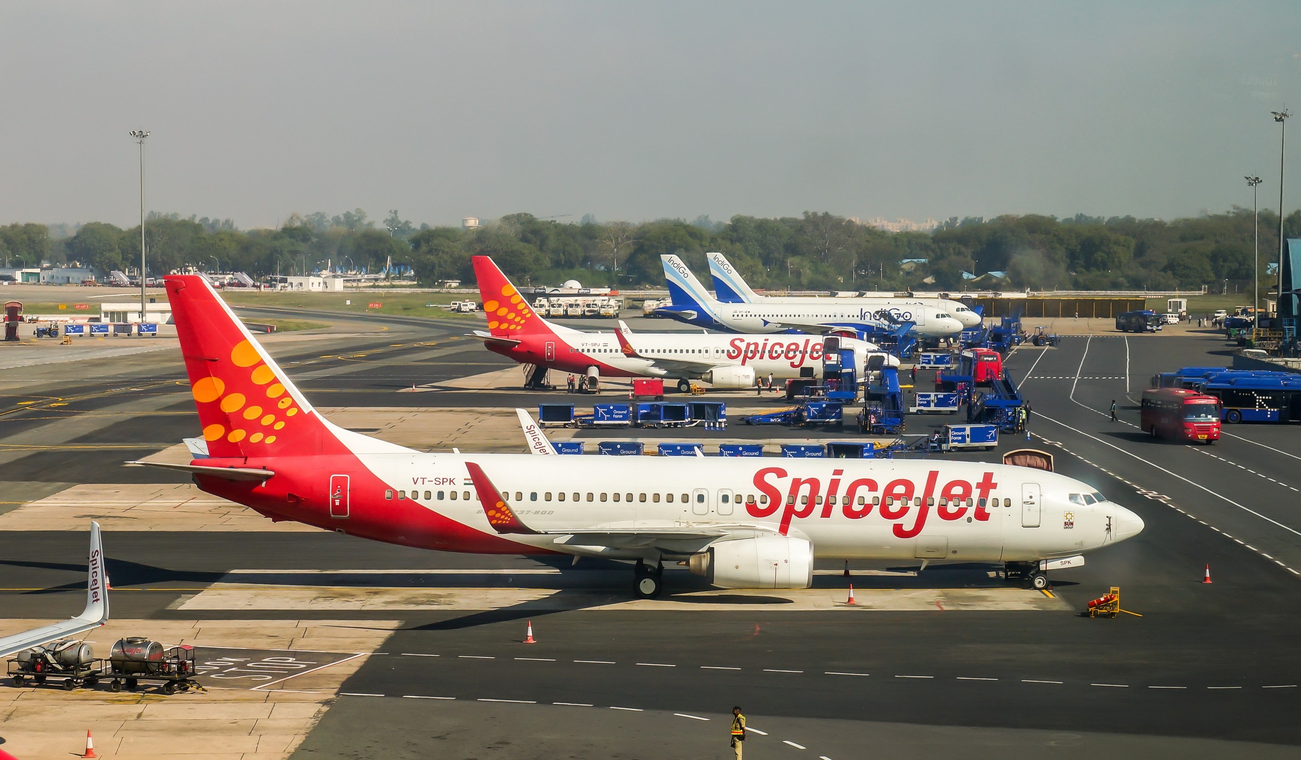 Several Airplanes parked at Delhi airport.