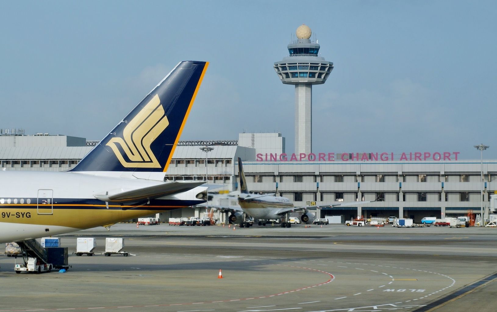 Singapore Changi Airport (SIN) with Singapore Airlines aircraft in the foreground and background