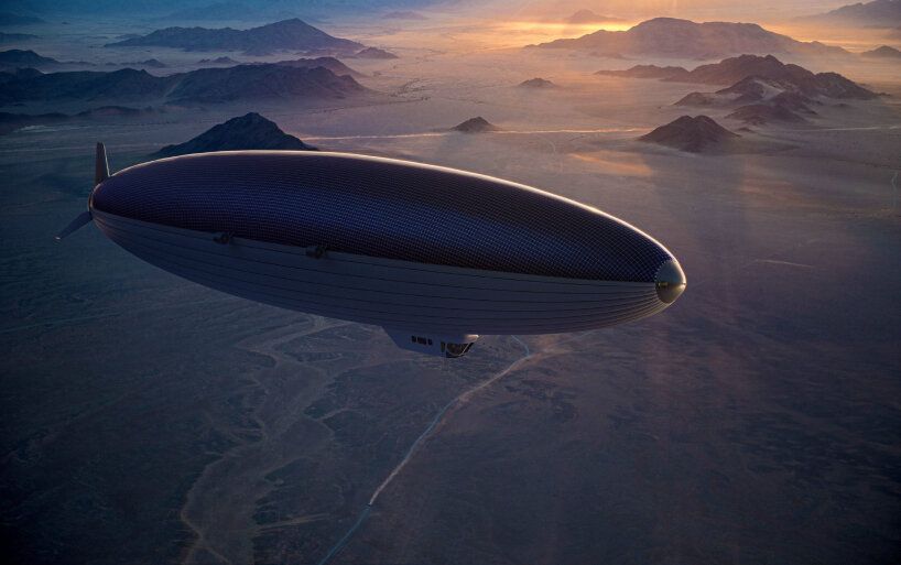 The Solar Airship One Flying over mountainous terrain.