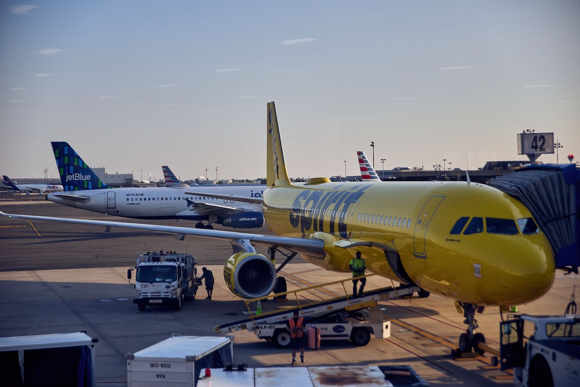 Spirit Airlines Airbus aircraft with a JetBlue jet in the background at Newark Liberty International Airport EWR