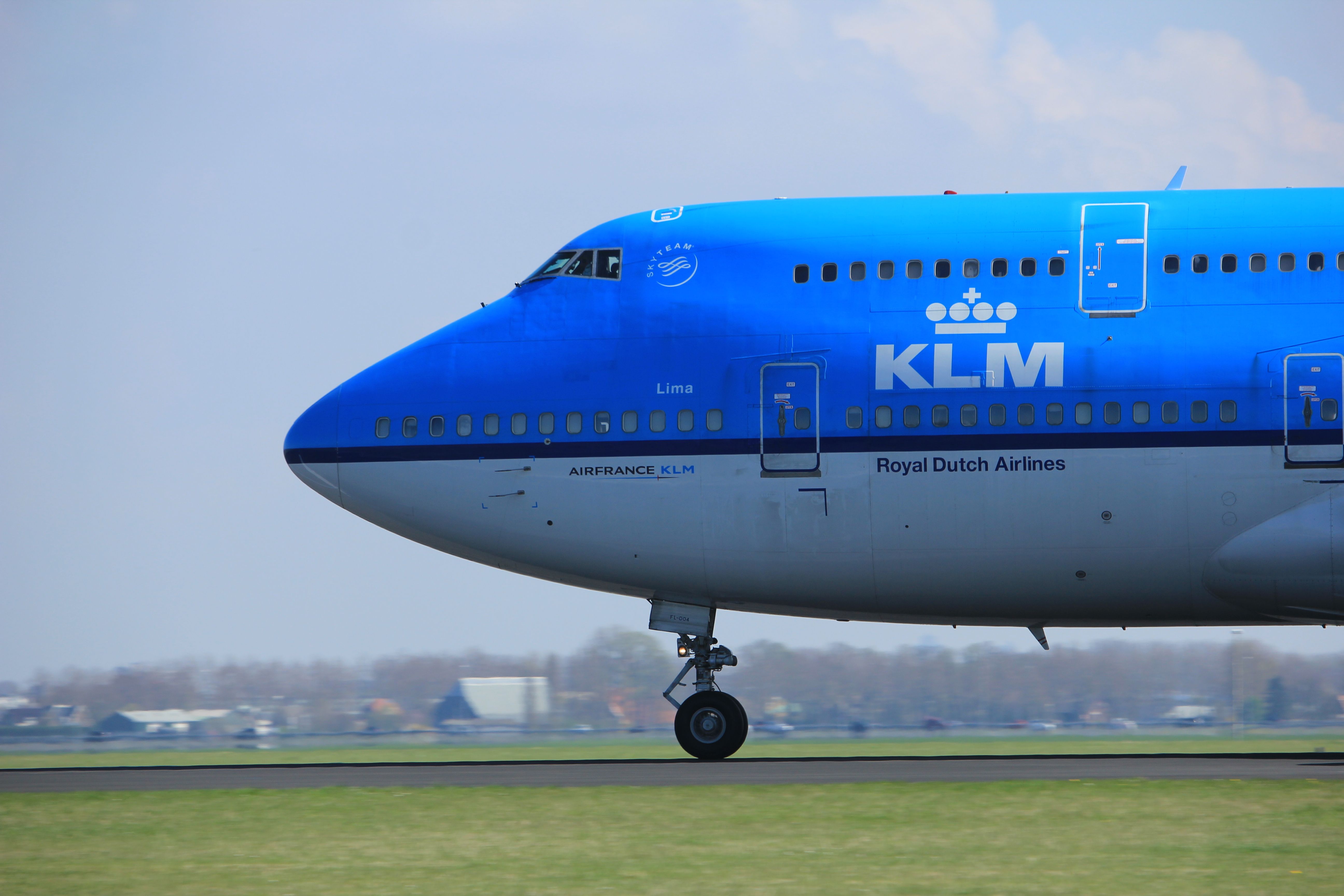 A closeup of a KLM 747-400 on a taxiway.