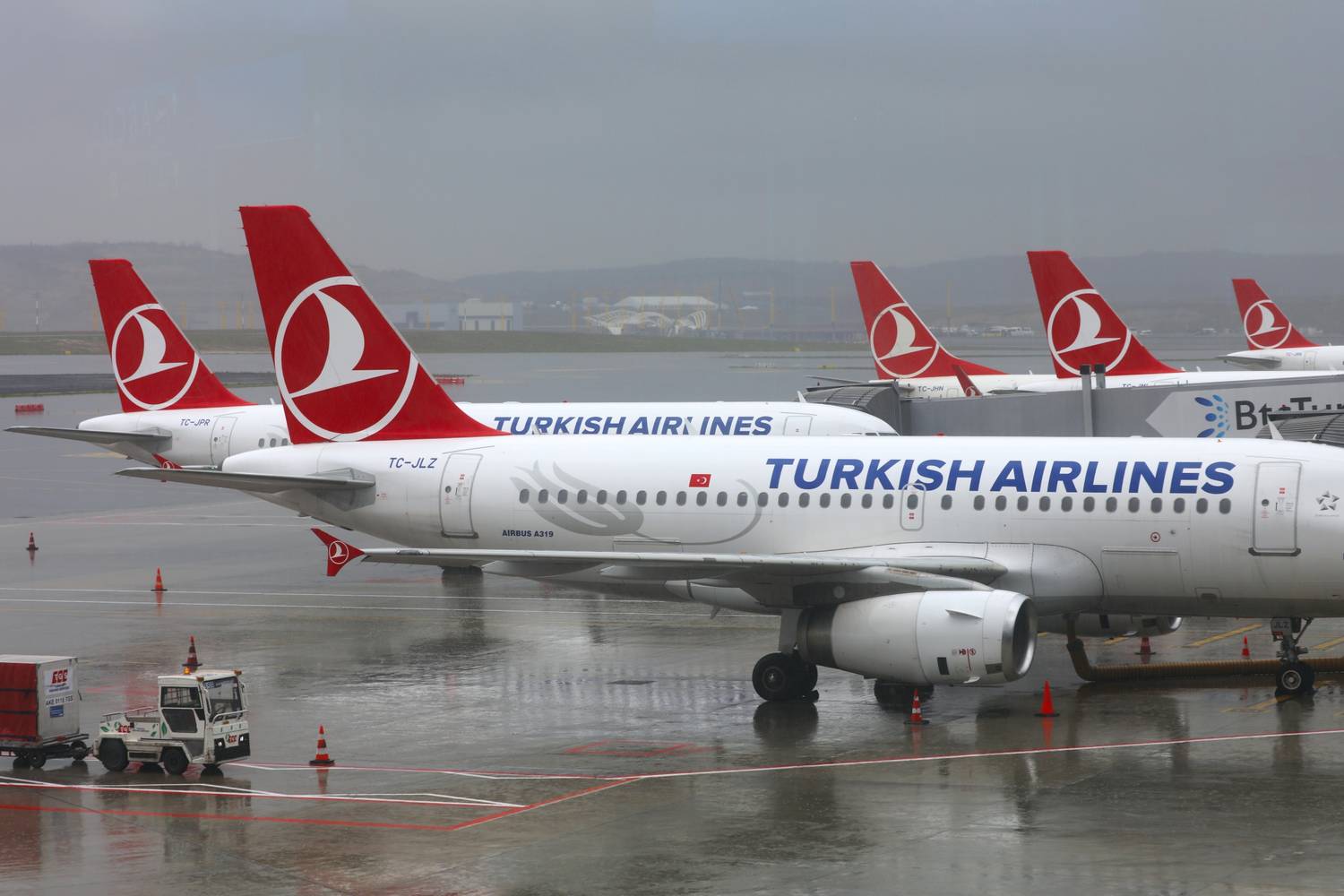 Five Turkish Airlines aircraft parked at Istanbul Airport.