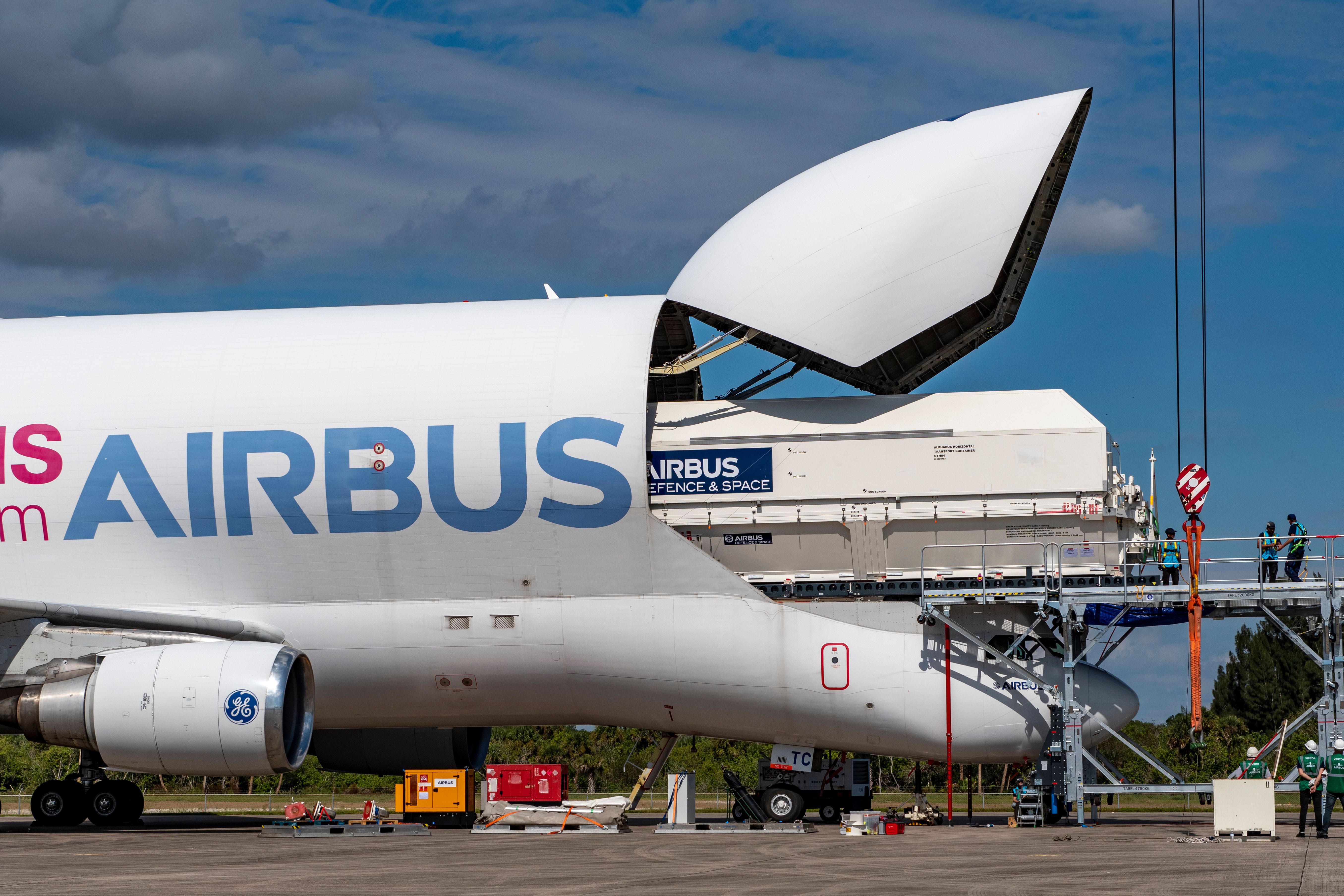 A Satellite vessel being unloaded from an Airbus Beluga XL aircraft.
