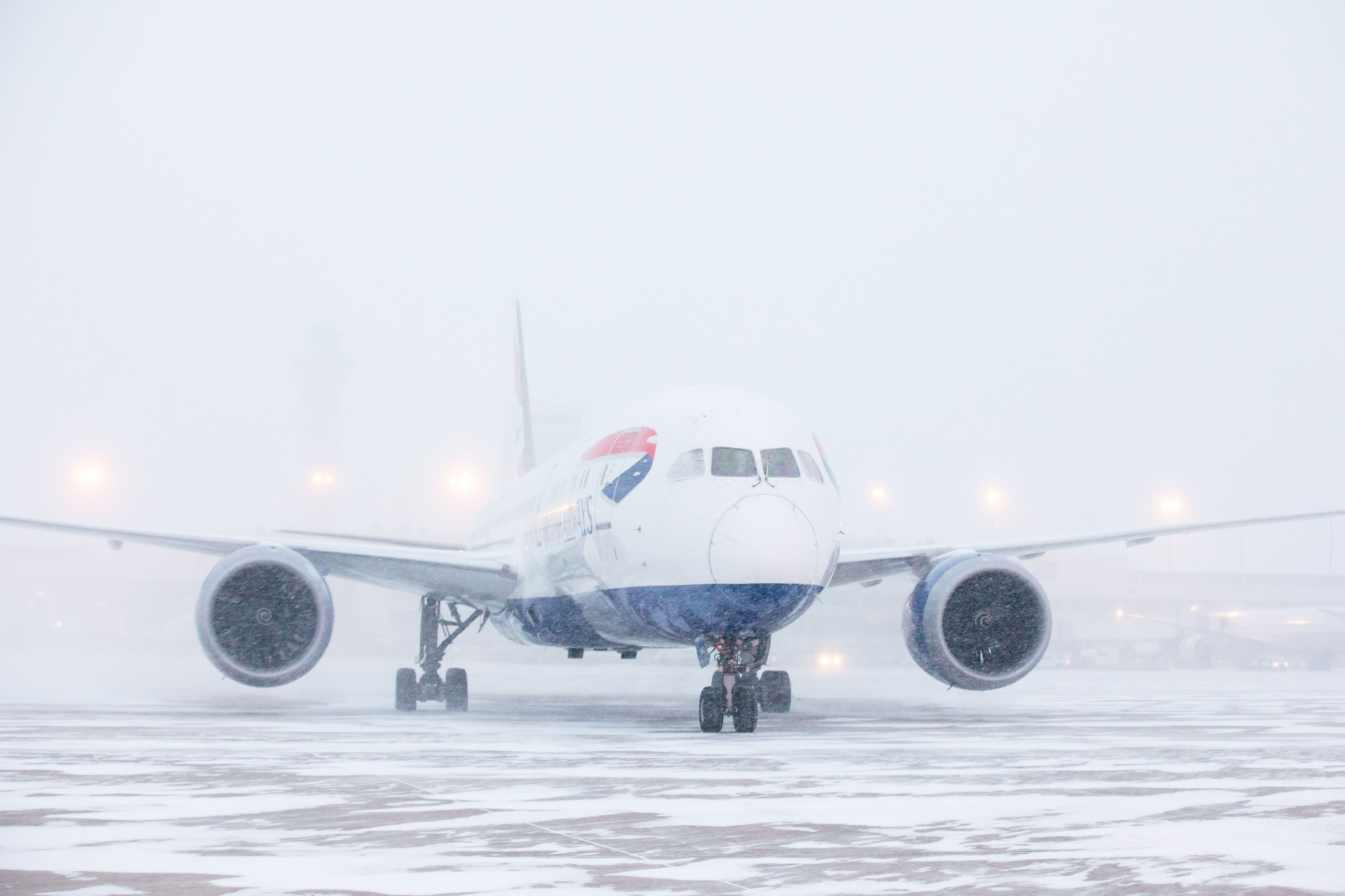 A British Airways plane landing in the snow.