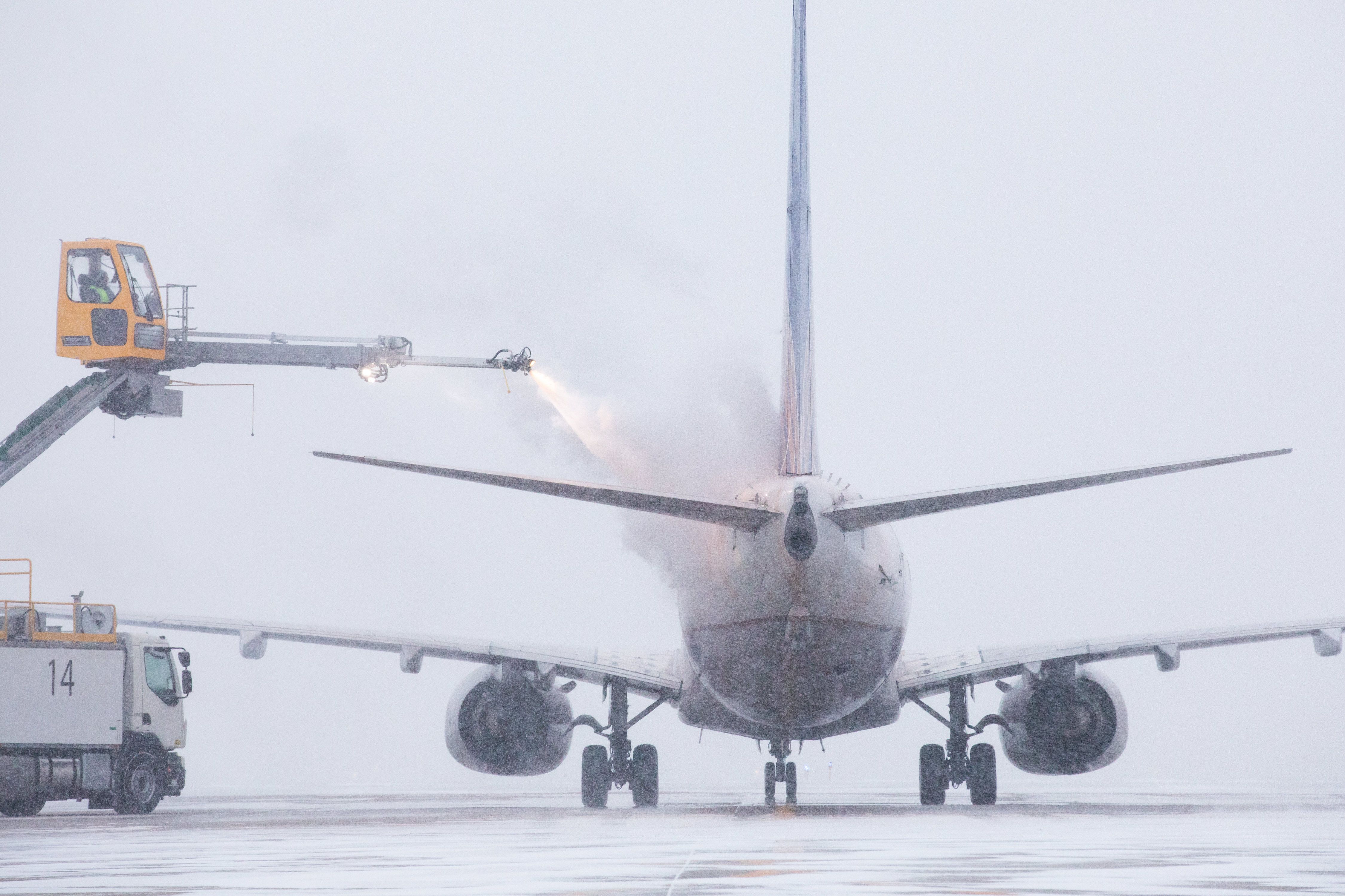 A United Airlines plane being sprayed with de-icing solution.