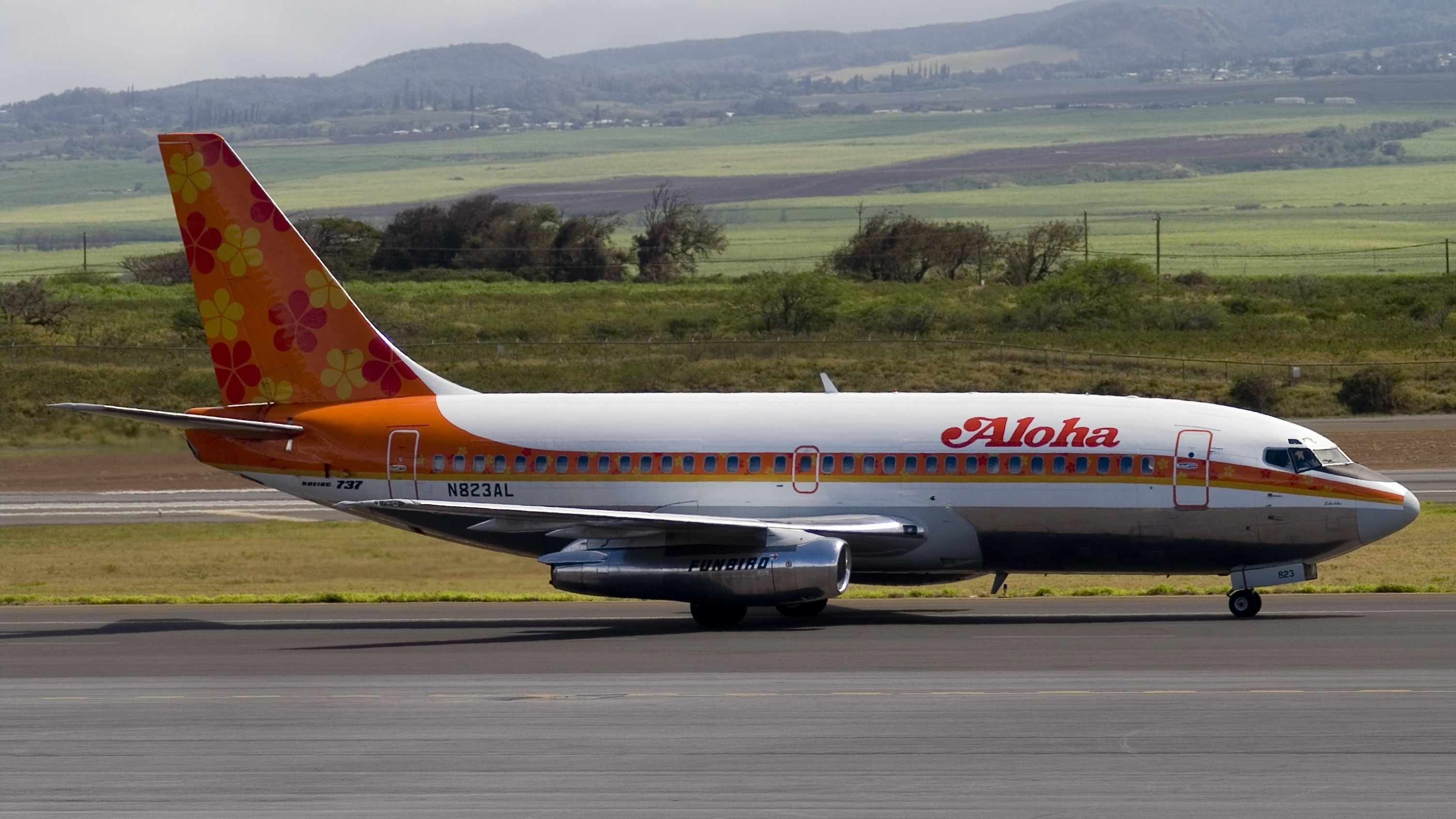 An Aloha Airlines aircraft on a taxiway.