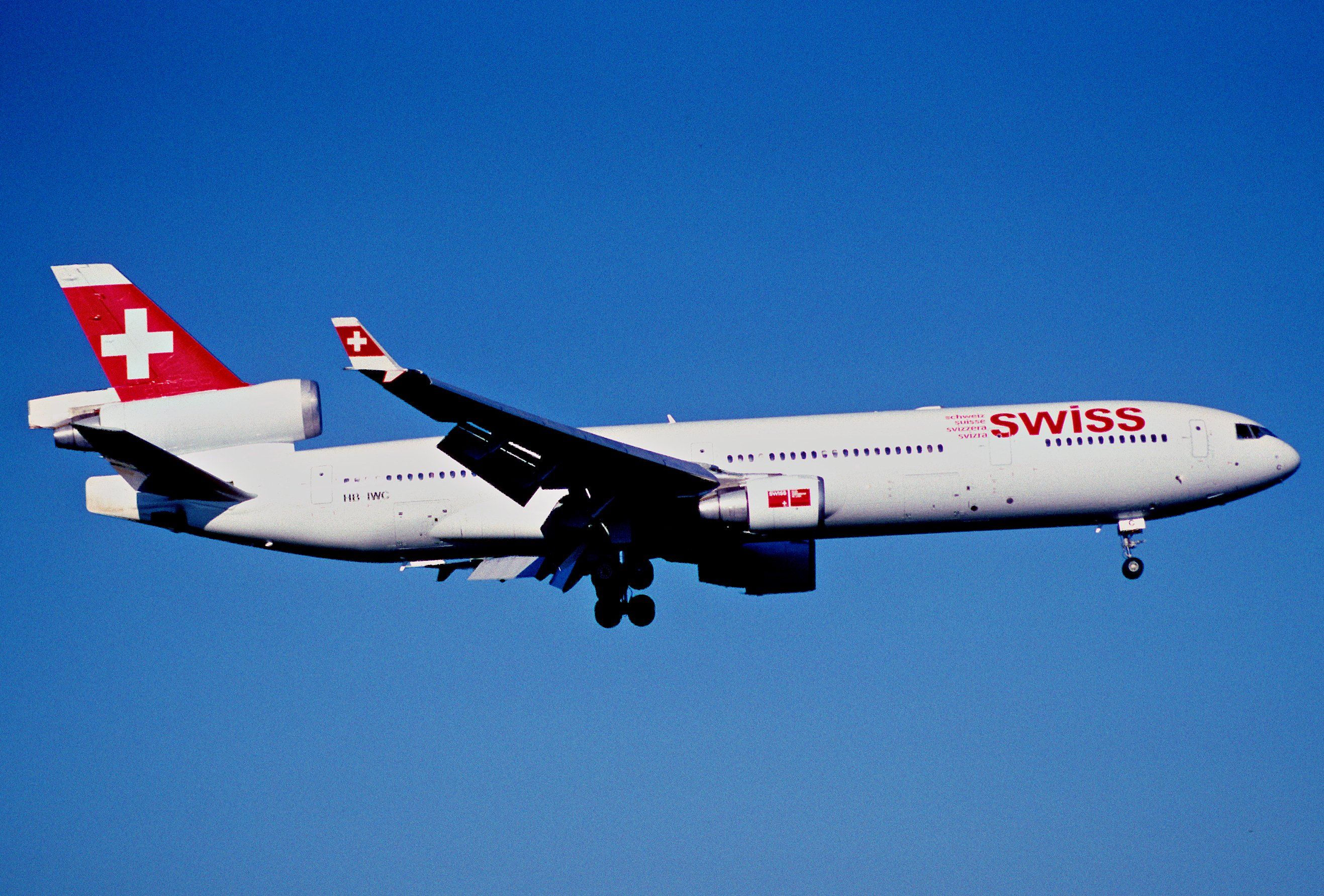A SWISS MD-11 flying in the sky.
