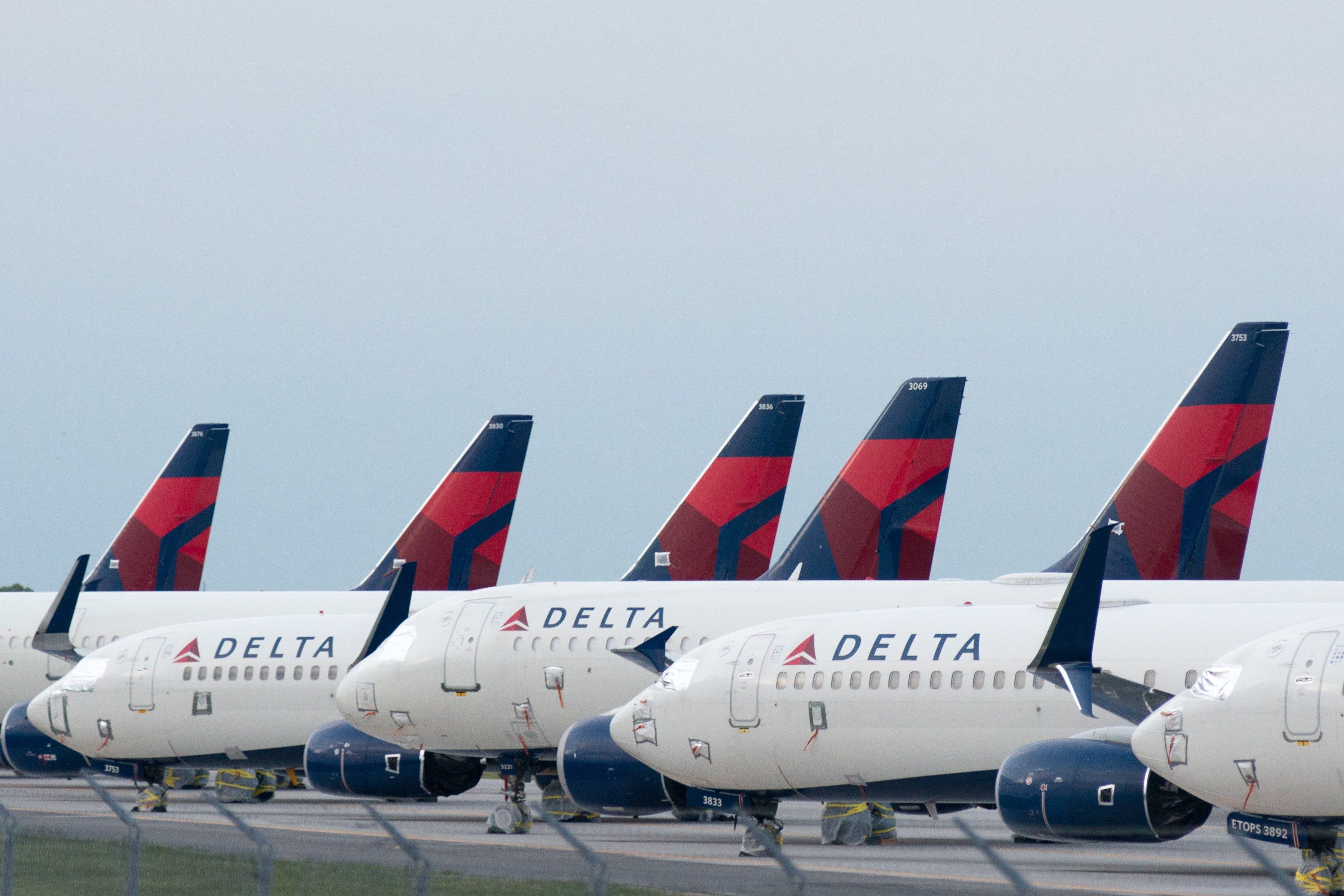 Several ​​​​​​​Delta Air Lines Aircraft Parked on the apron at Kansas City International Airport.