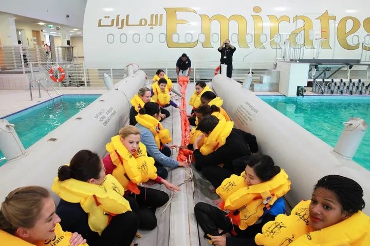 Several Emirates cabin crew in a raft during ditching training.