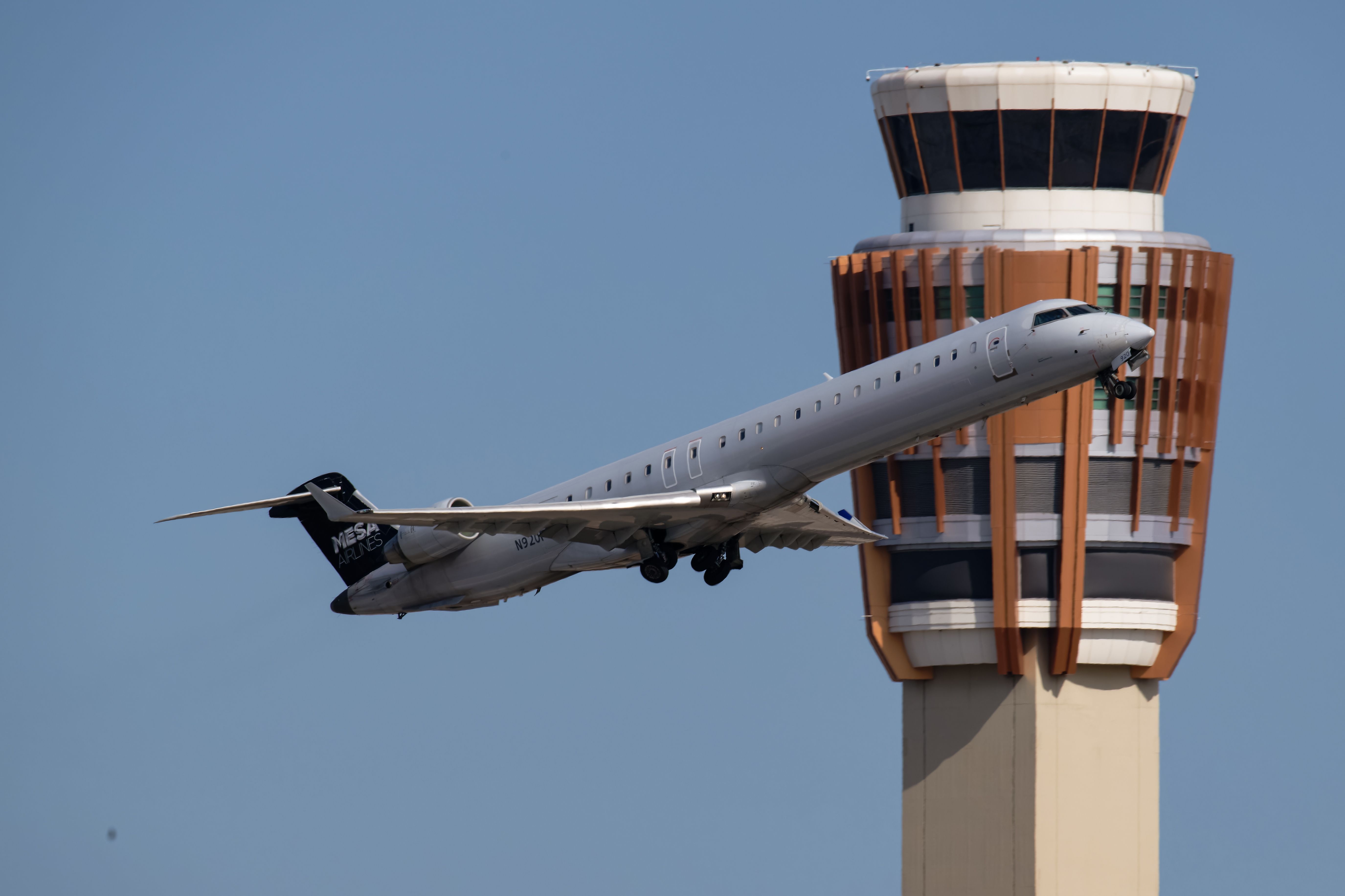A Mesa Airlines Bombardier CRJ-900 departing