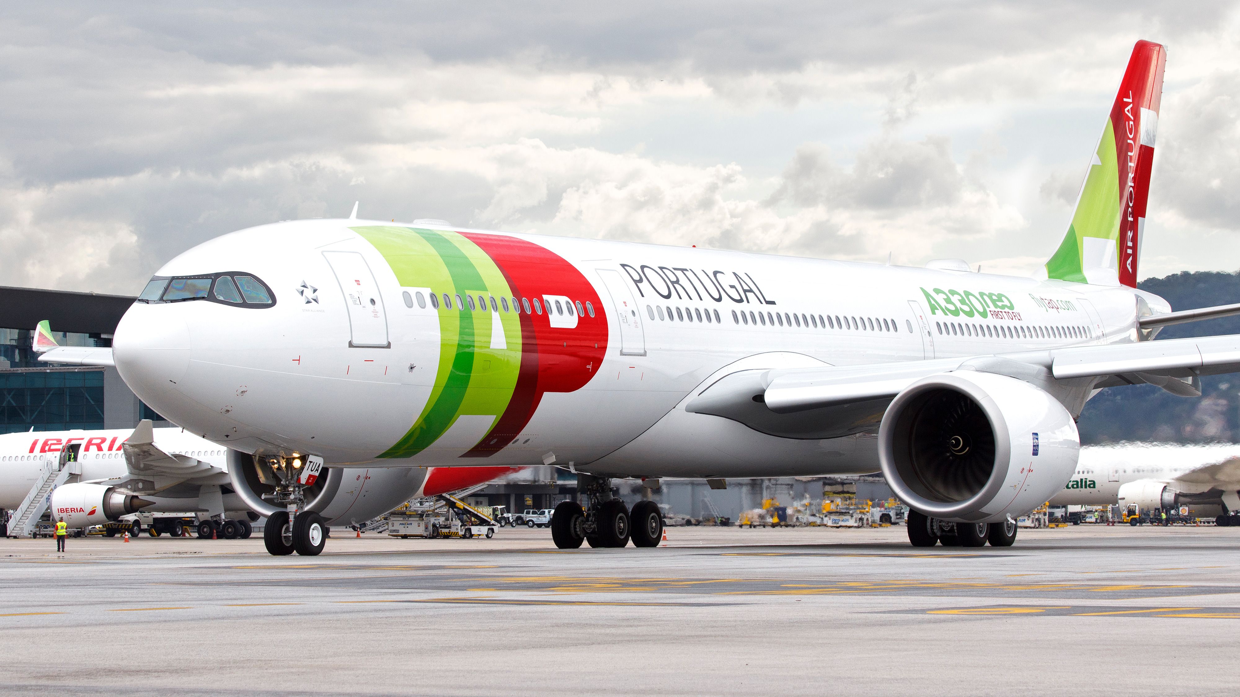 A TAP Air Portugal A330neo on an airport apron.