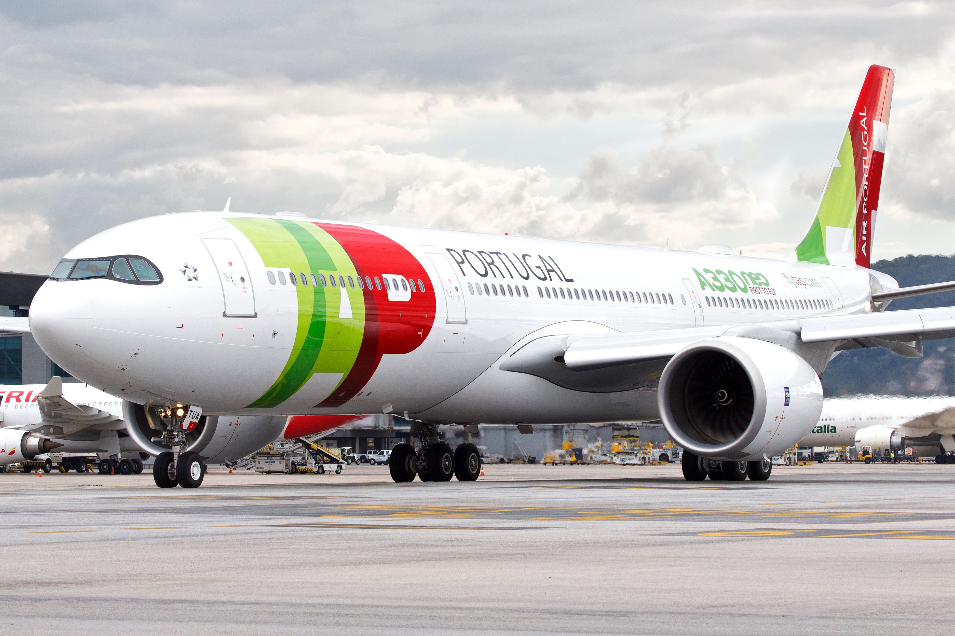 A TAP Air Portugal A330neo on an airport apron.