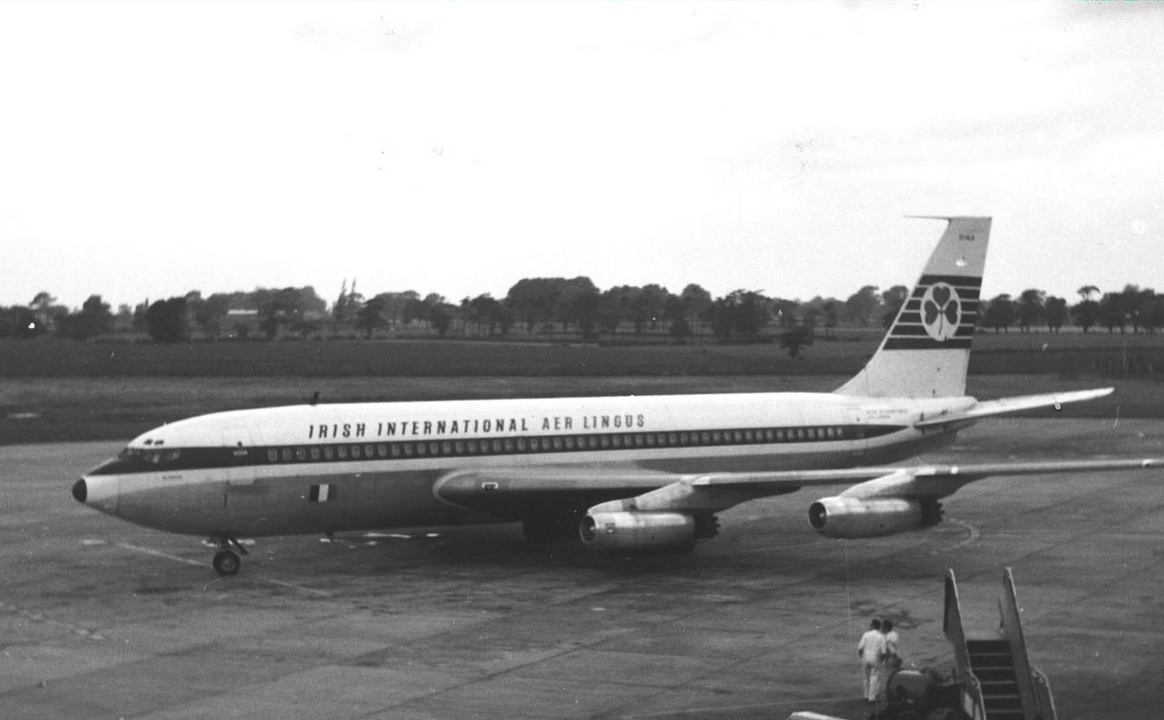 An Irish International Aero Lingus Boeing 720 on an airport apron.