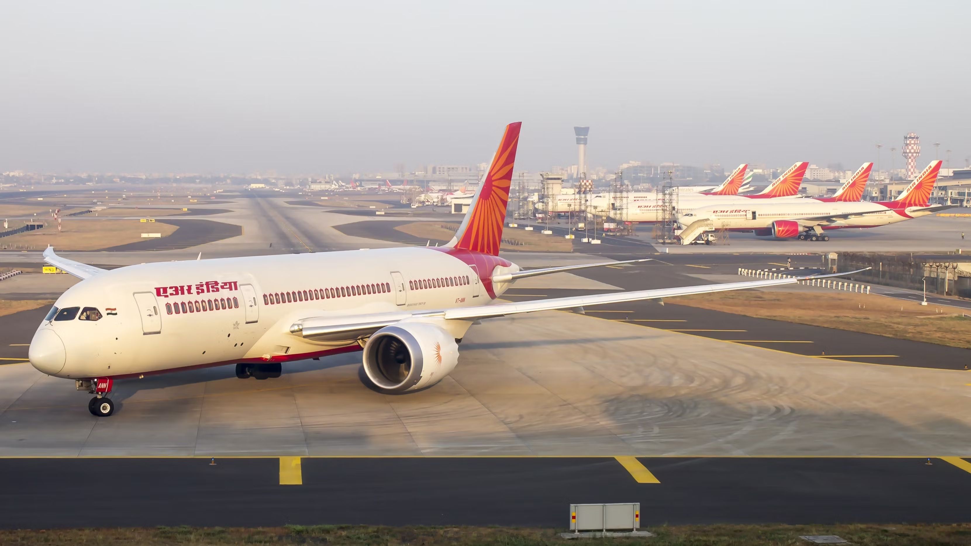 An Air India Boeing 787 at the end of a taxiway.