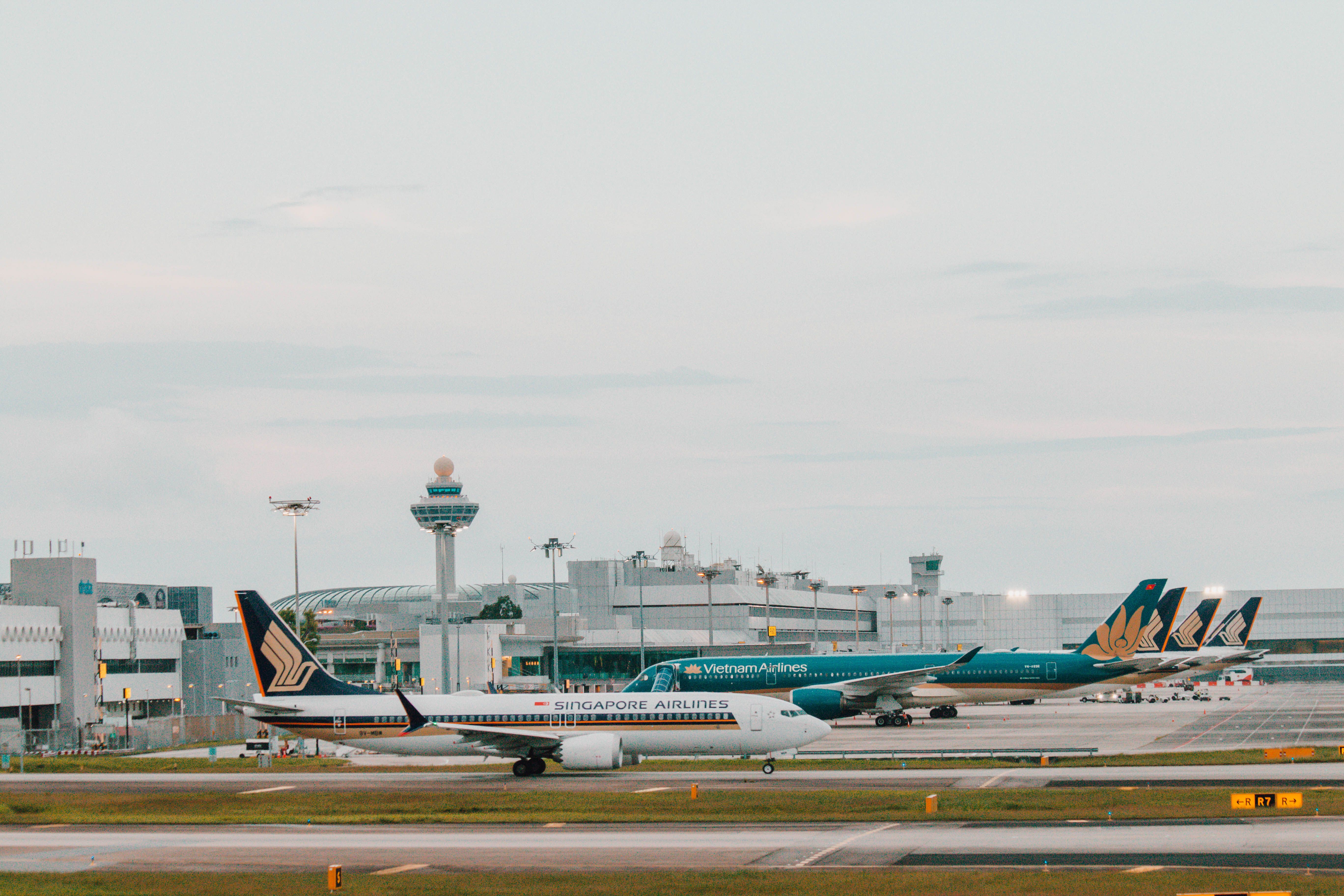 Singapore Airlines and Vietnam Airlines on the apron at Singapore Changi Airport.