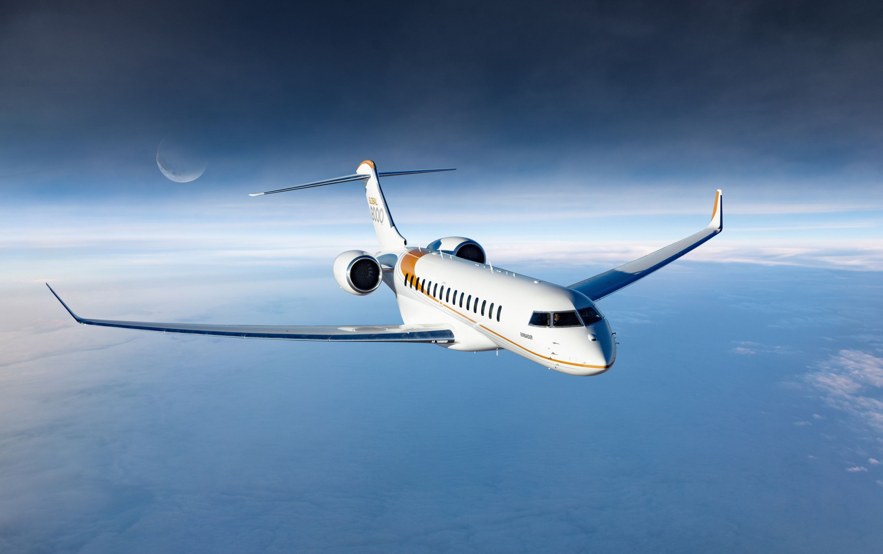 A Bombardier Global 8000 flying in the sky.