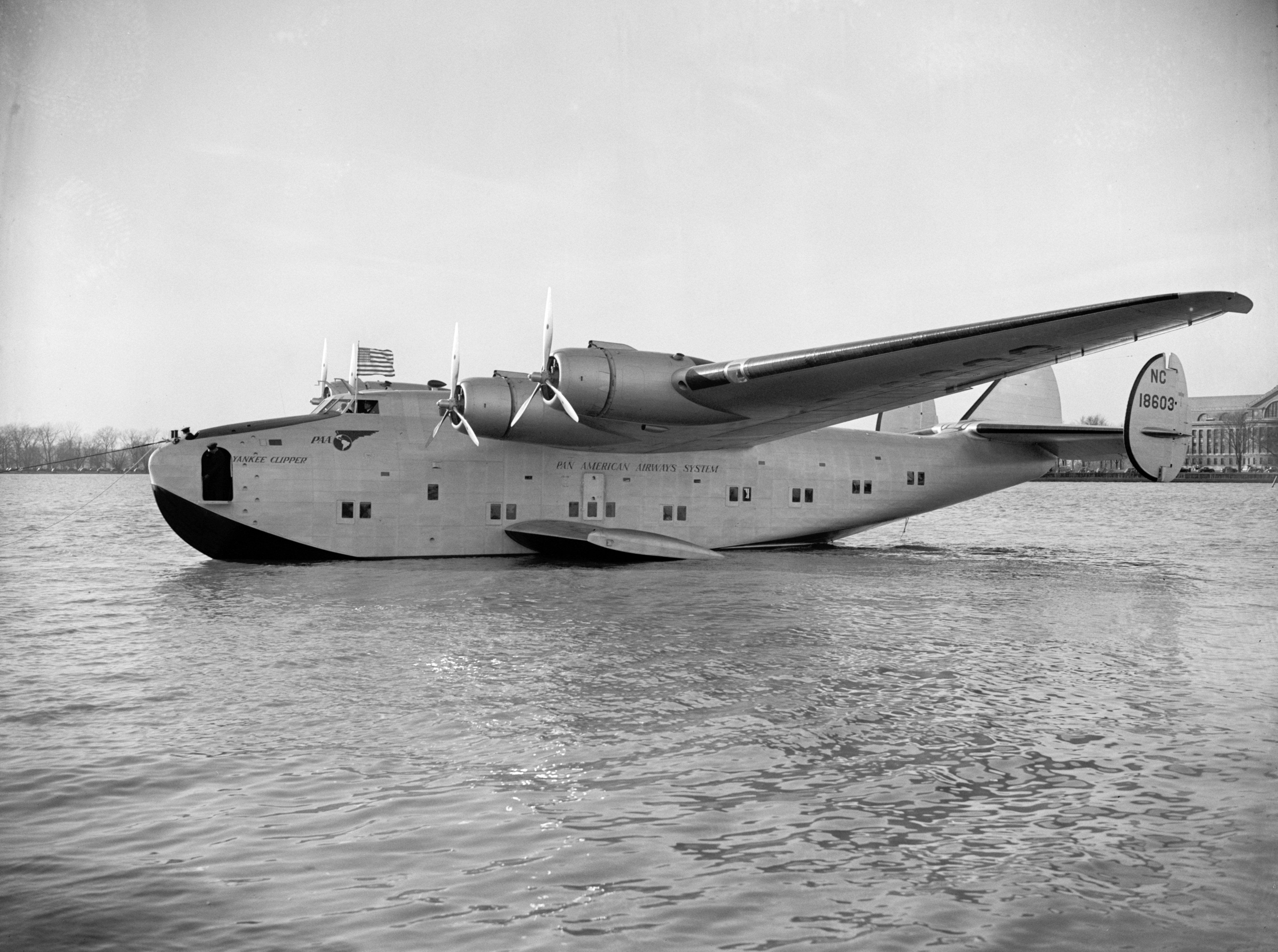 A Boeing 314 named the Yankee Clipper parked in a body of water.