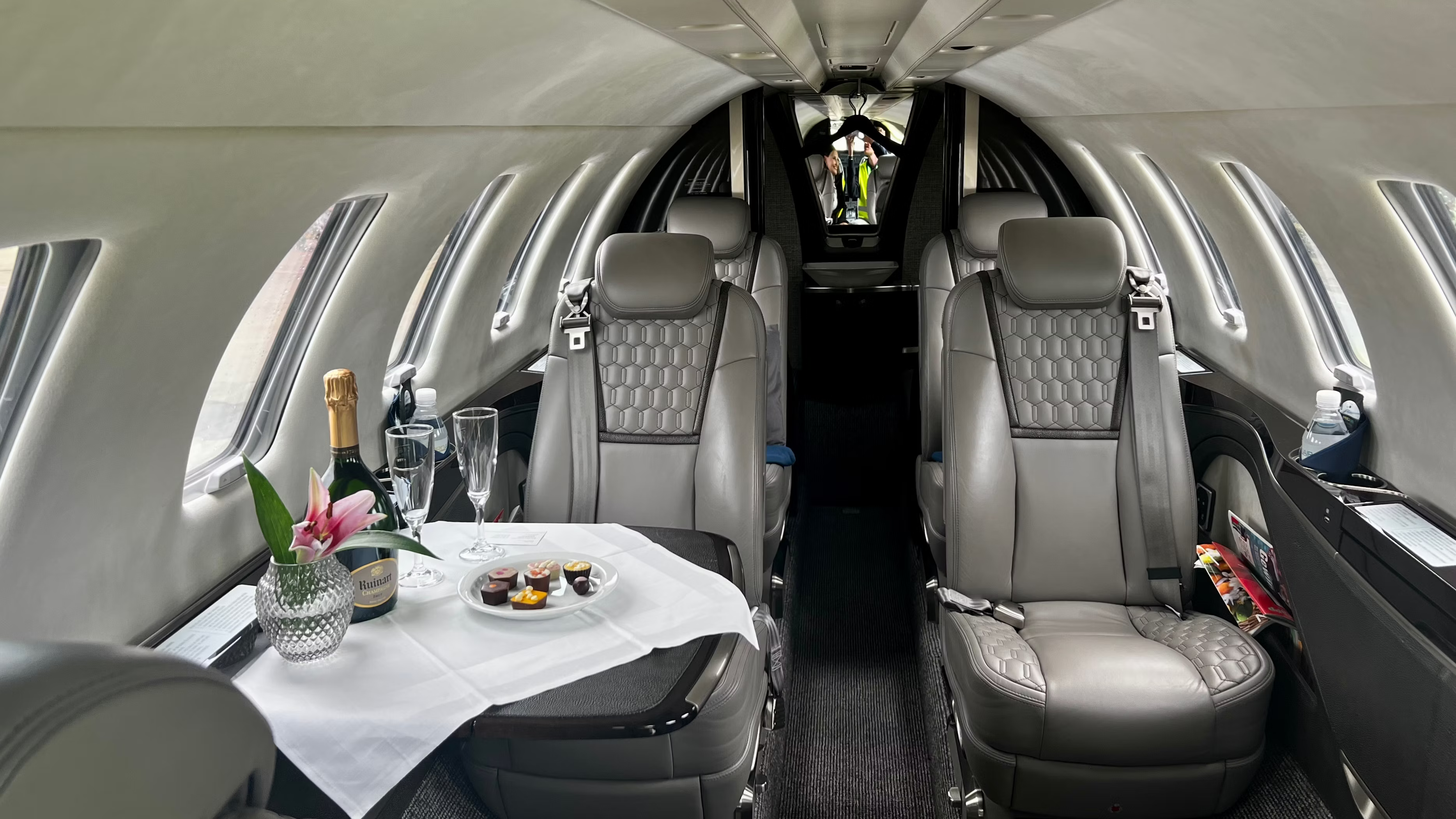 Inside the main cabin of a small business jet.