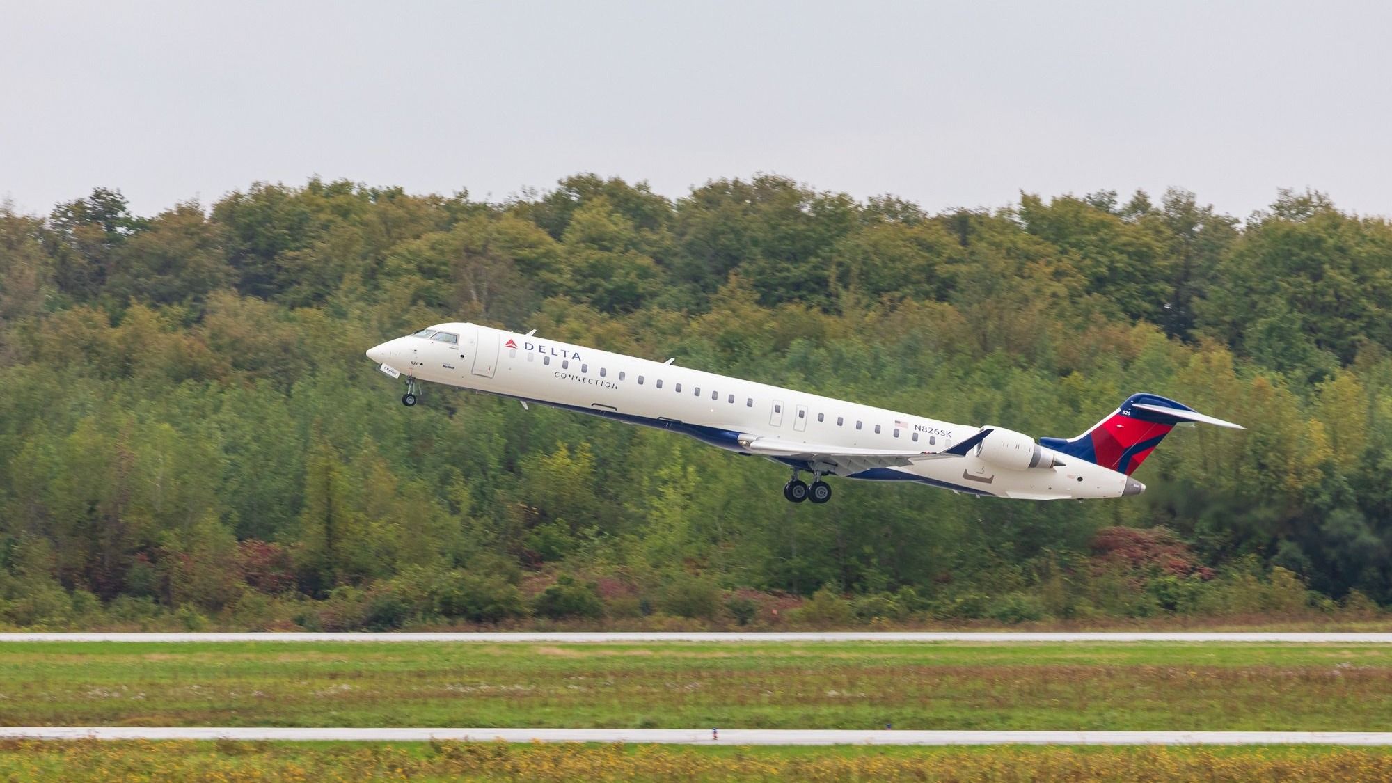Delta Connection (SkyWest Airlines) Bombardier CRJ900 taking off. 
