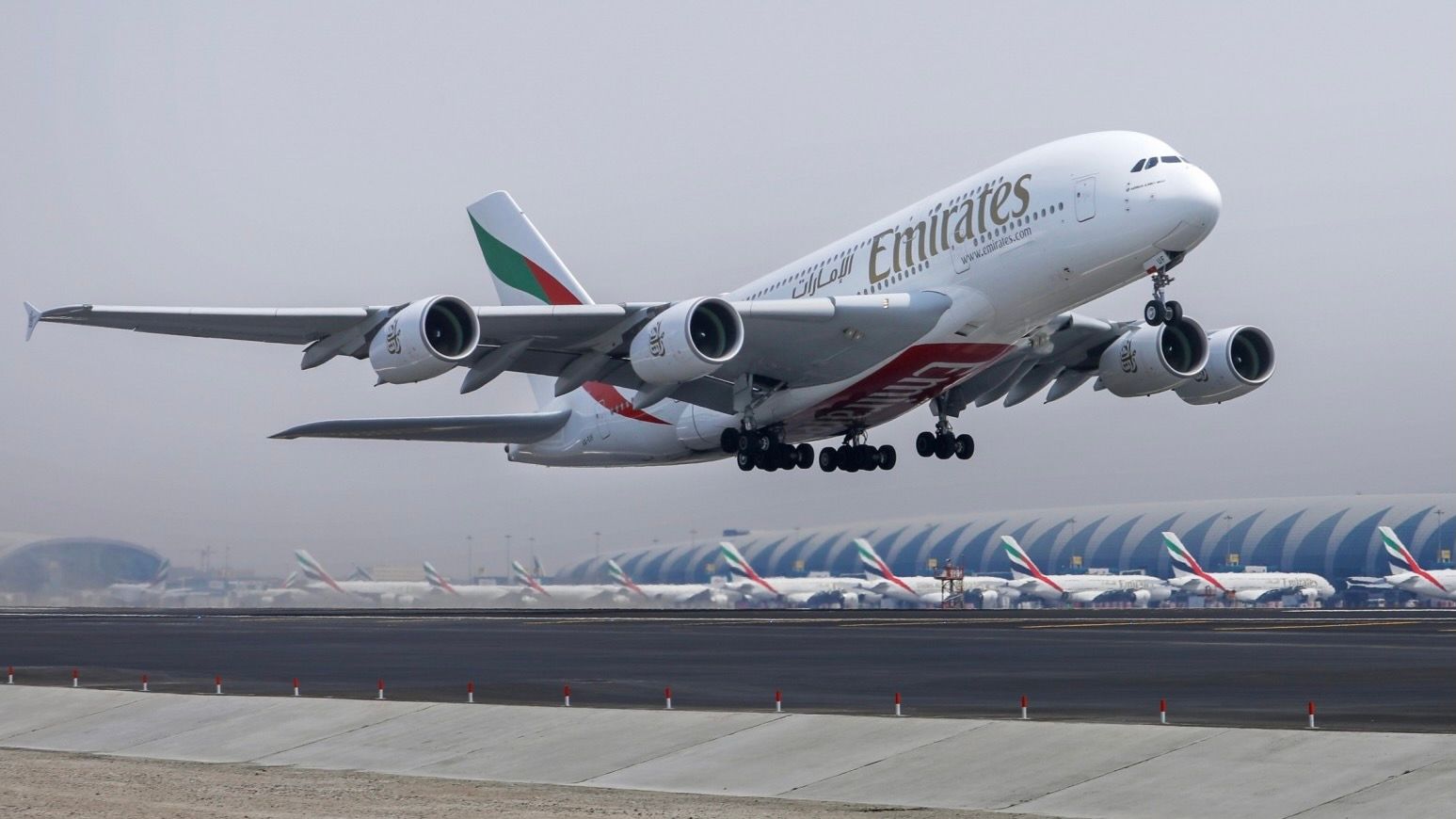 An Emirates Airbus A380 taking off from Dubai International Airport.