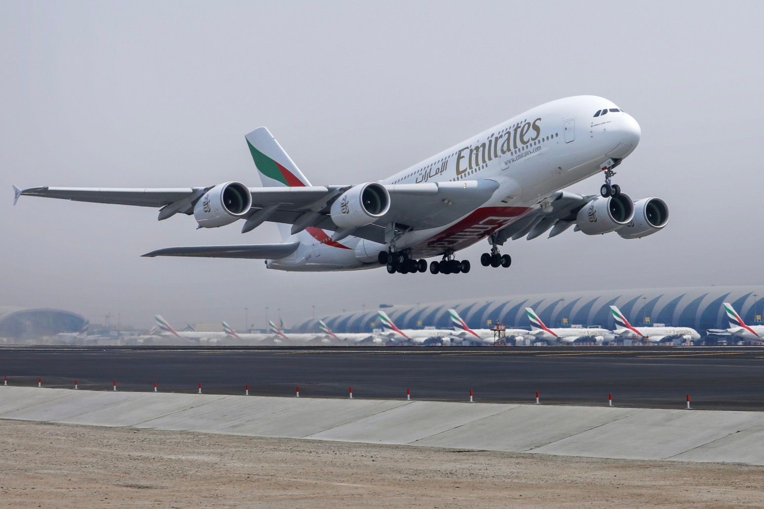An Emirates Airbus A380 taking off from Dubai International Airport.