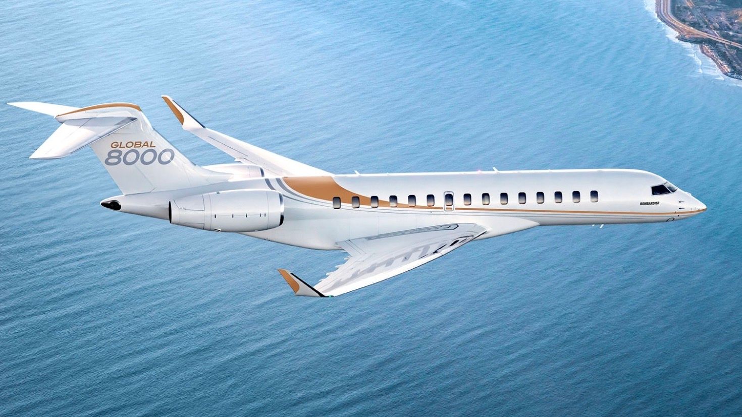 A Bombardier Global 8000 flying over the ocean.